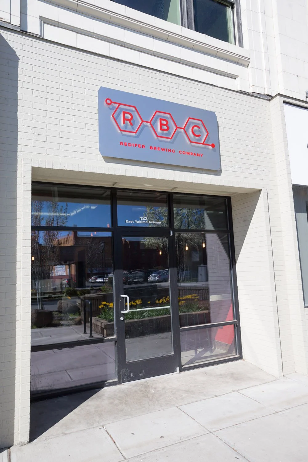 Brewery storefront entrance with logo sign