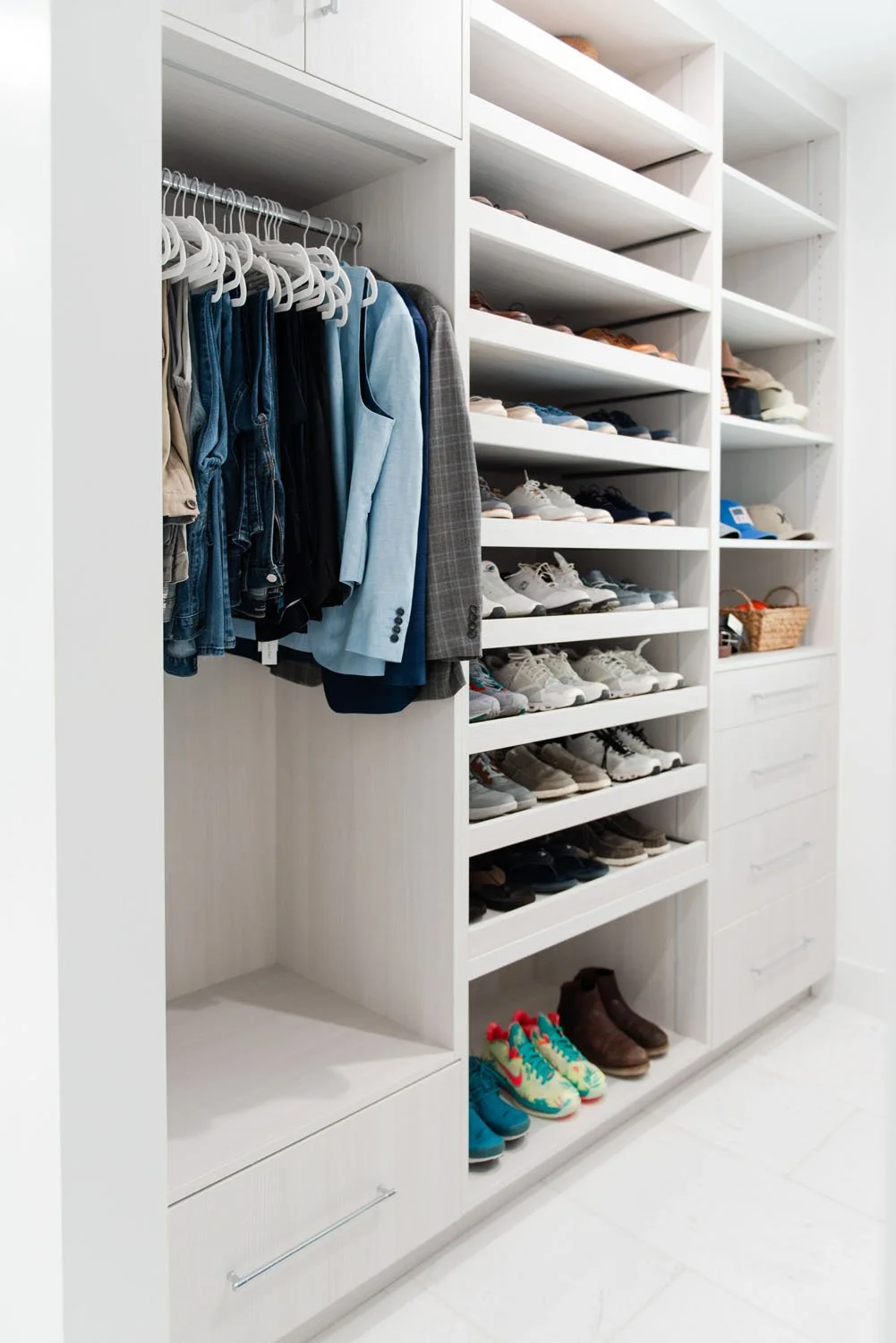 Walk-in closet with white shelving and shoe storage