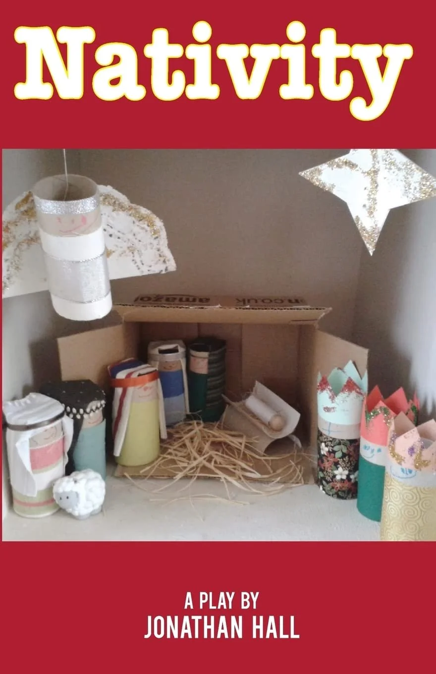 Cover image for a play titled 'Nativiy' by Jonathan Hall. The cover features a handmade nativity scene with small paper and craft materials, including paper tubes and straw, decorated with glitter and patterns, against a plain background.