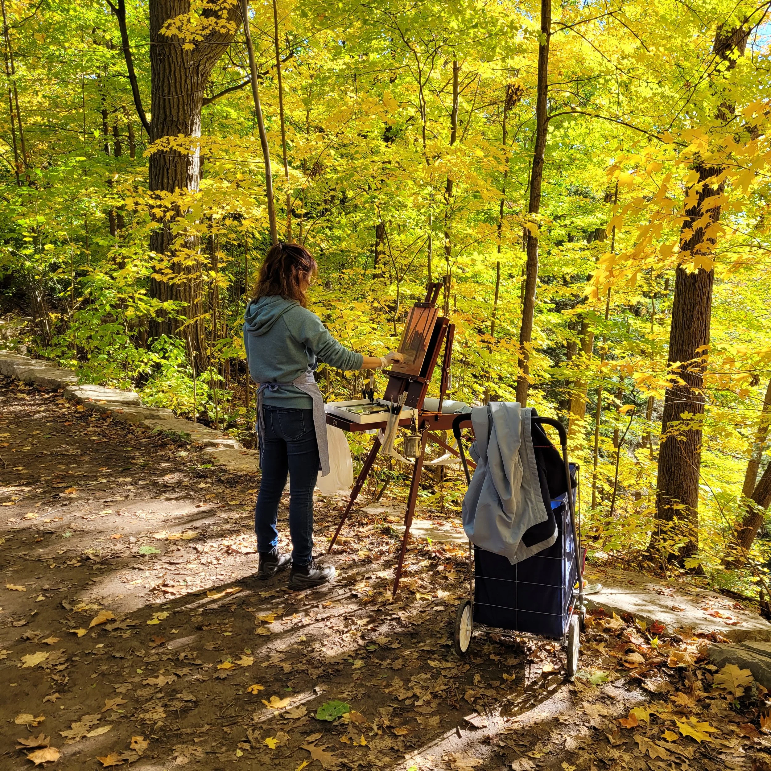 student painting en plein air during a class by Cheryl-Ann Hills