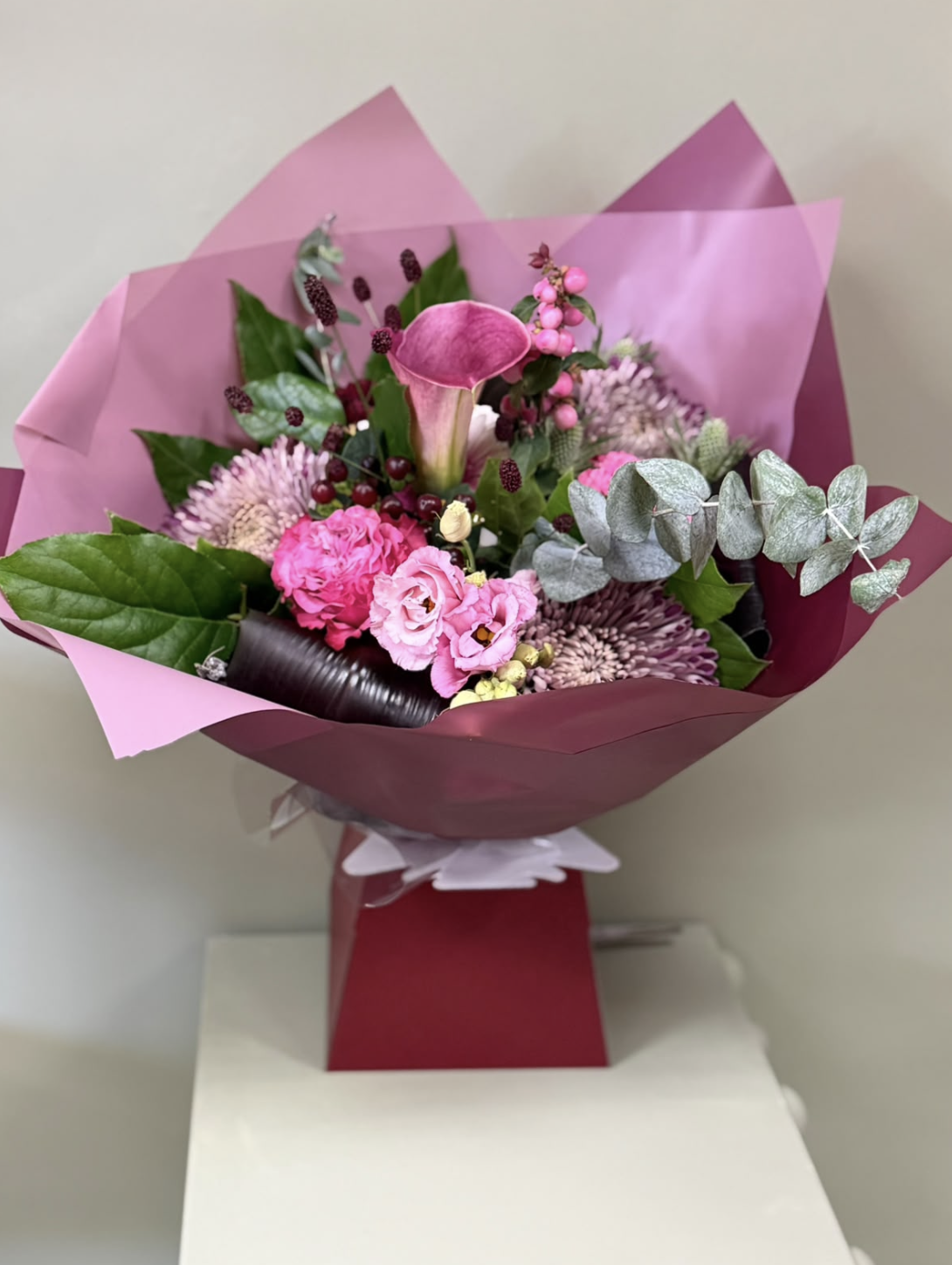 Fig & Berries pink bouquet with calla lily, roses and berries by Blossom's House of Flowers
