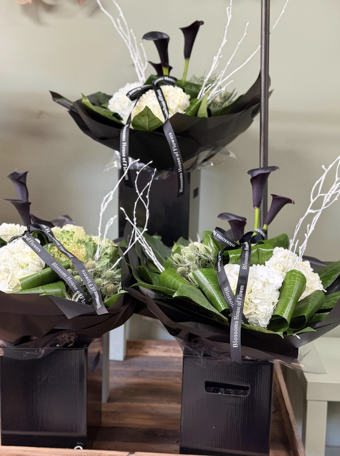 Maleficent bouquet with black calla lilies and white hydrangea by Blossom's House of Flowers