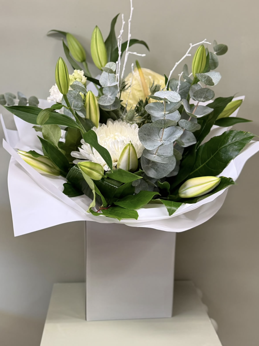 Alabaster white bouquet with lilies, chrysanthemum and eucalyptus by Blossom's House of Flowers
