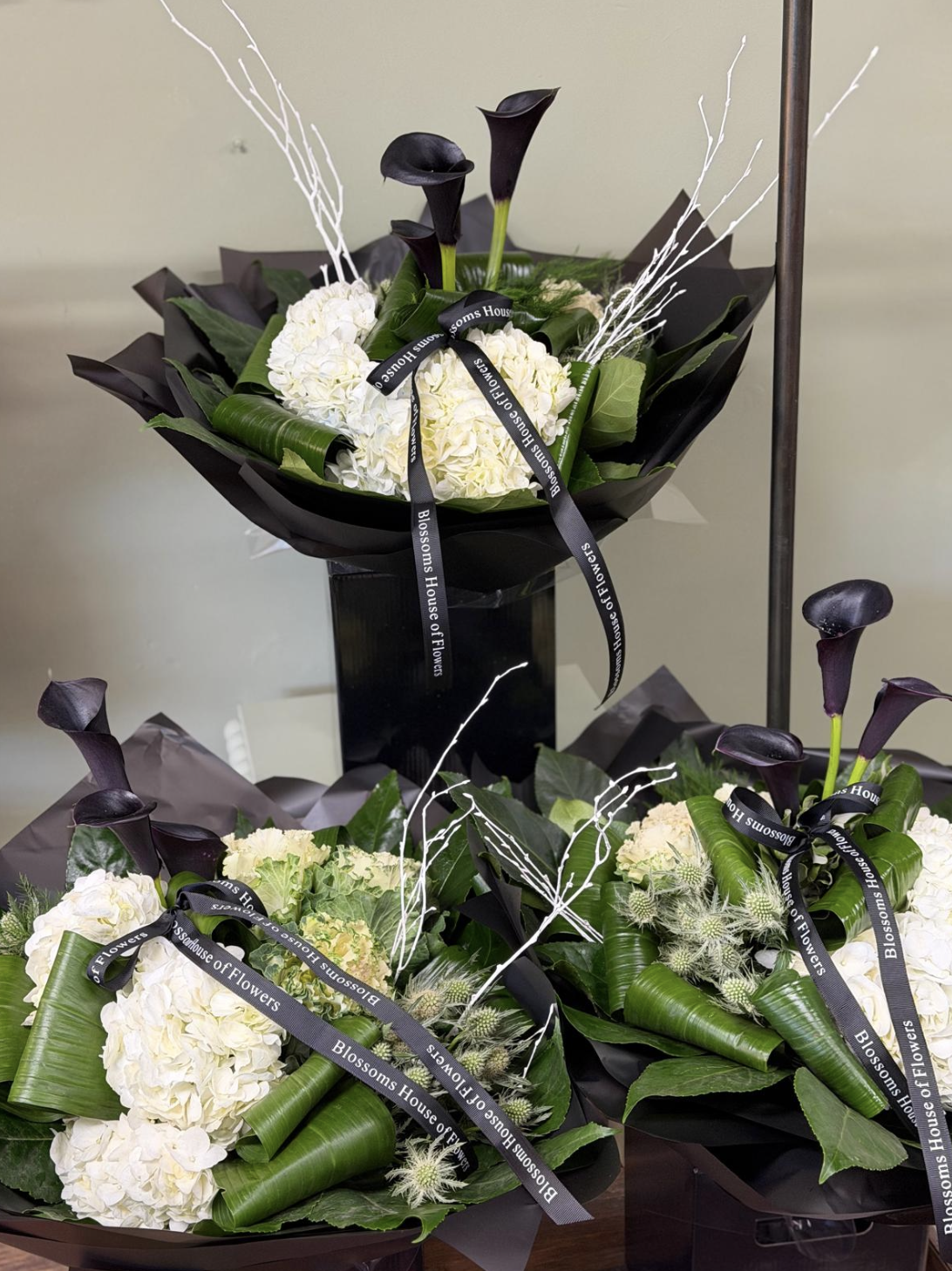Maleficent bouquet with black calla lilies and white hydrangea by Blossom's House of Flowers