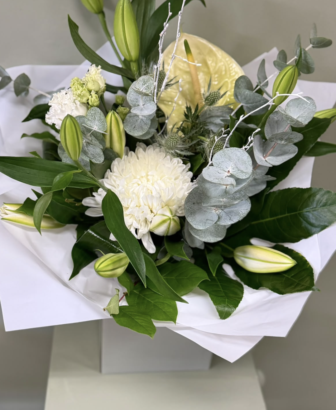 Alabaster white bouquet with lilies, chrysanthemum and eucalyptus by Blossom's House of Flowers