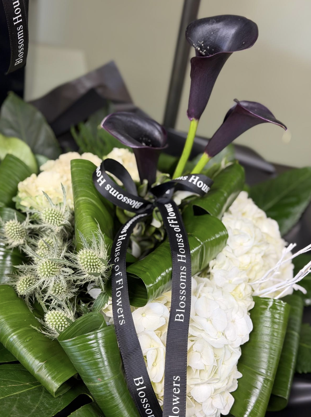 Maleficent bouquet with black calla lilies and white hydrangea by Blossom's House of Flowers