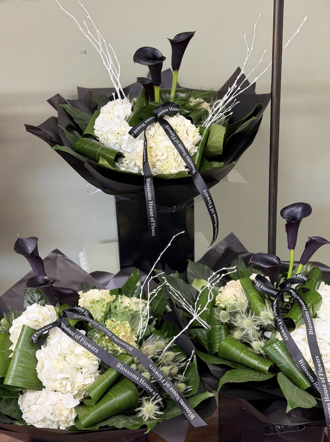 Maleficent bouquet with black calla lilies and white hydrangea by Blossom's House of Flowers