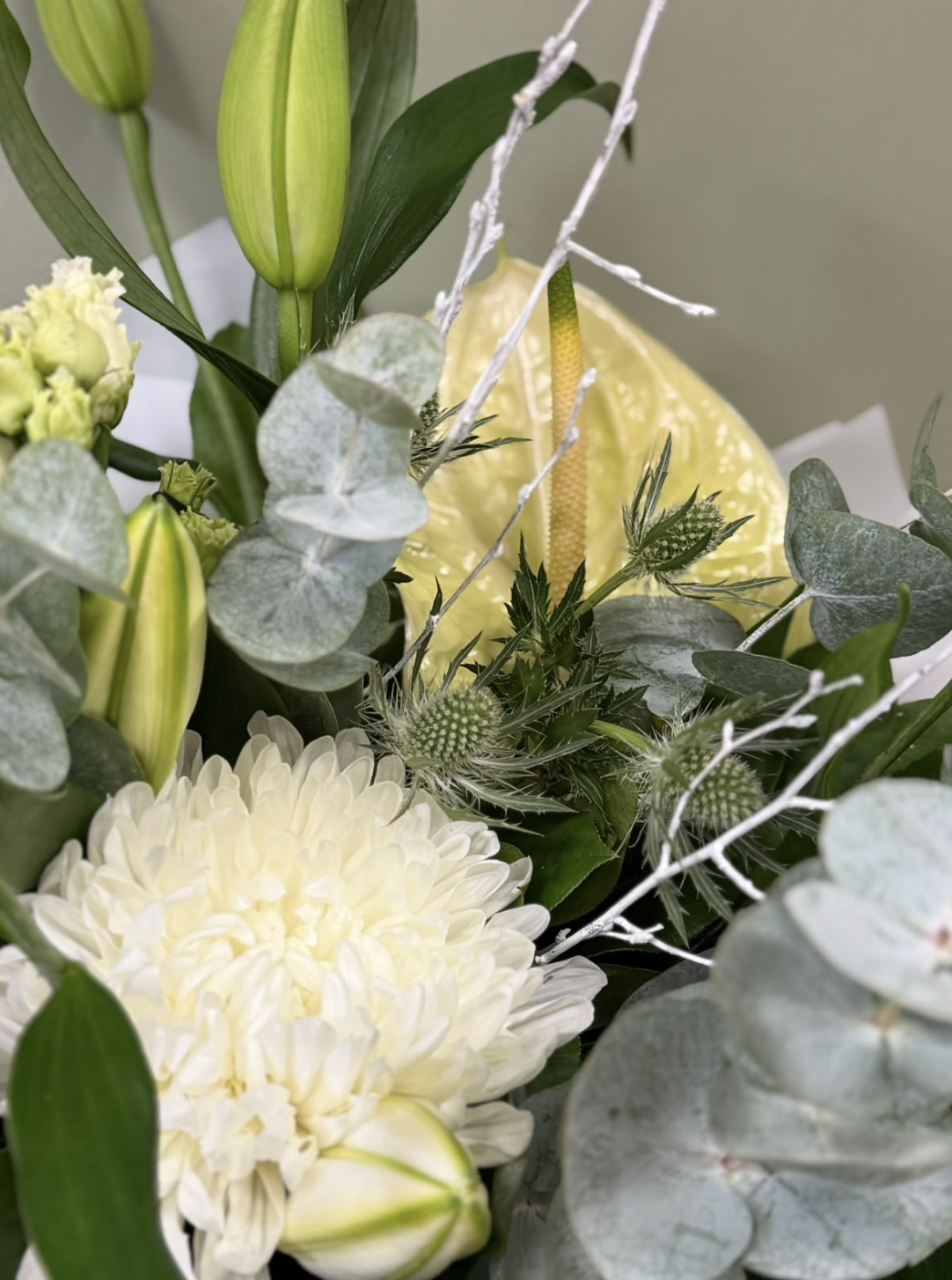 Alabaster white bouquet with lilies, chrysanthemum and eucalyptus by Blossom's House of Flowers