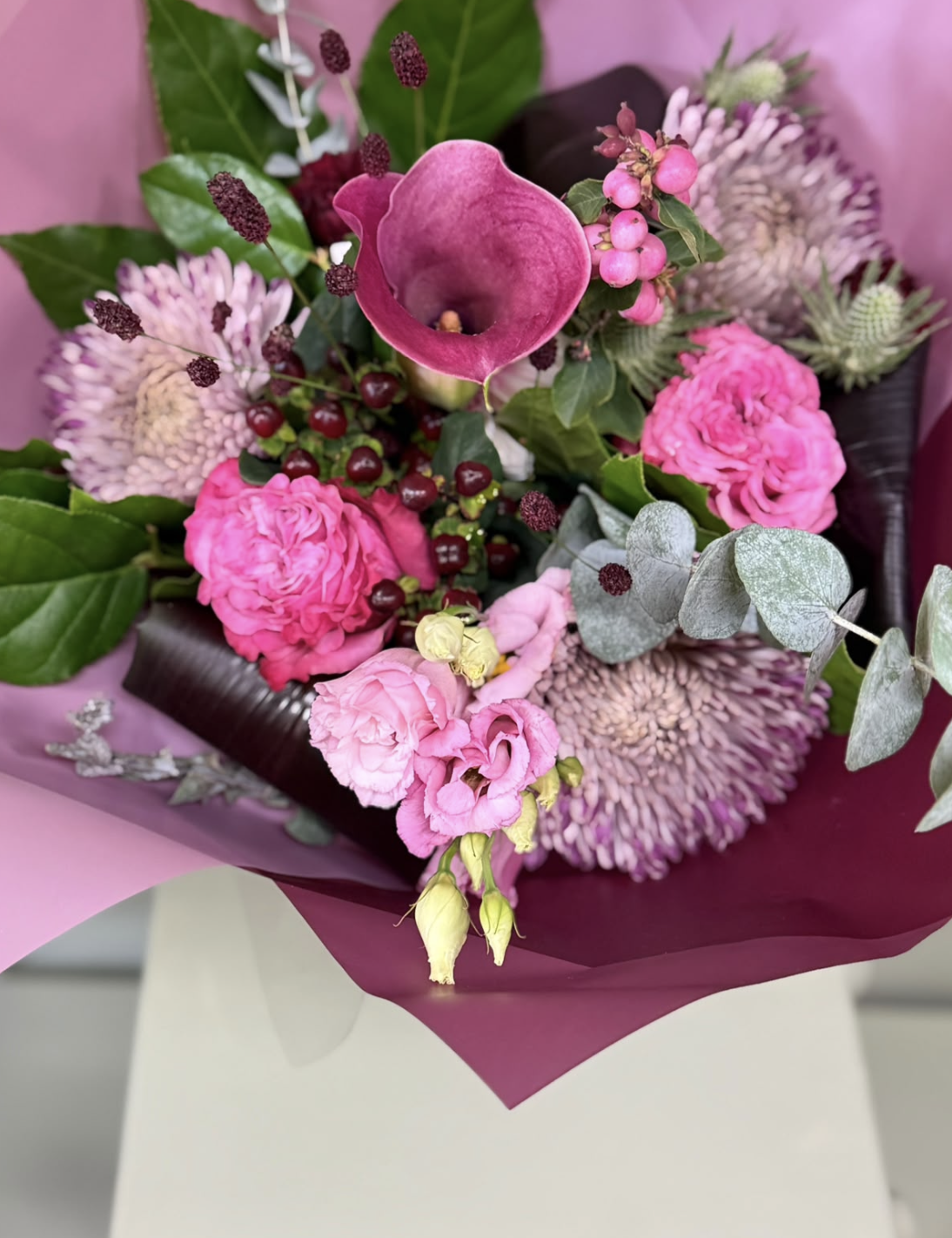 Fig & Berries pink bouquet with calla lily, roses and berries by Blossom's House of Flowers