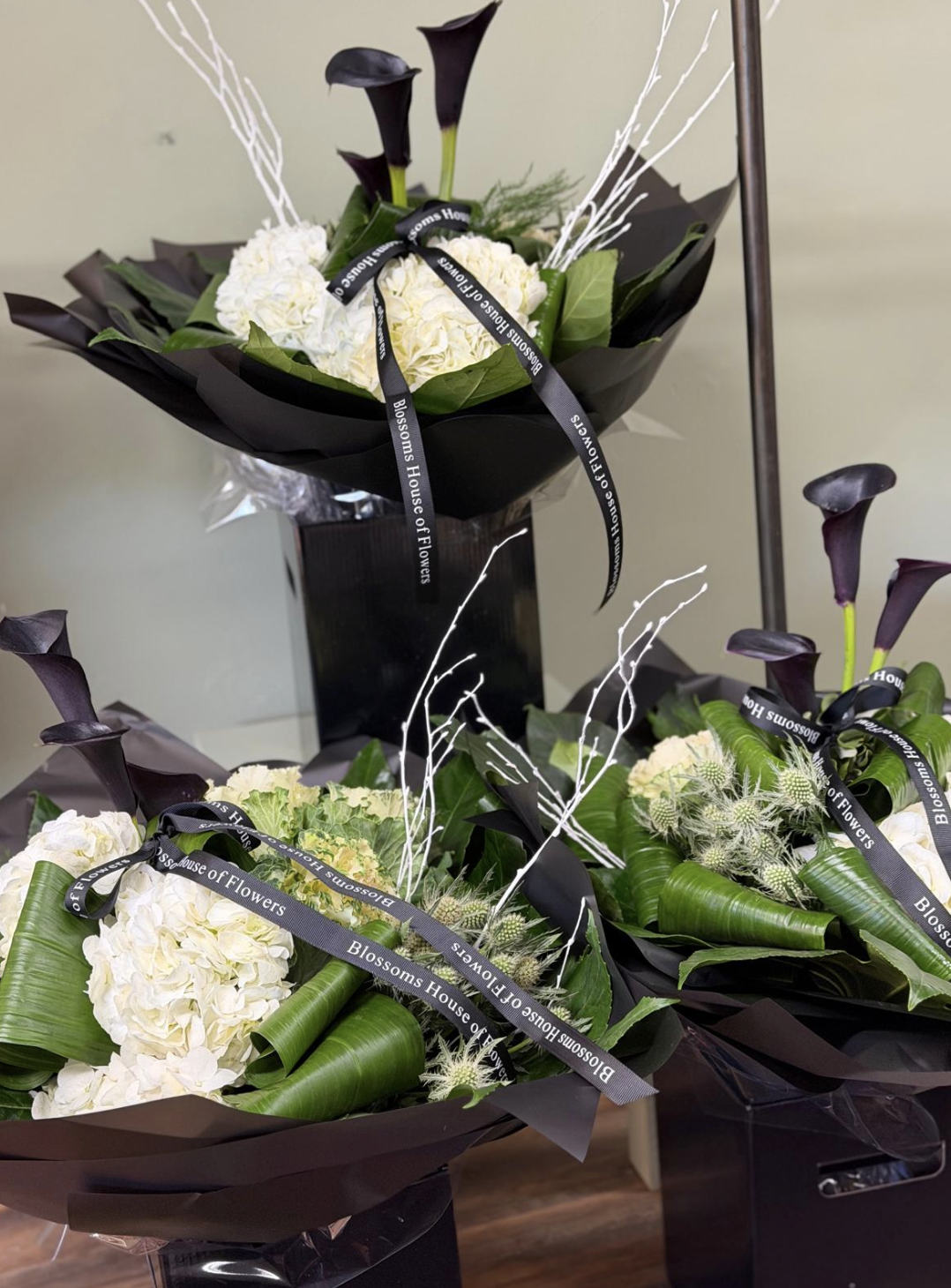Maleficent bouquet with black calla lilies and white hydrangea by Blossom's House of Flowers