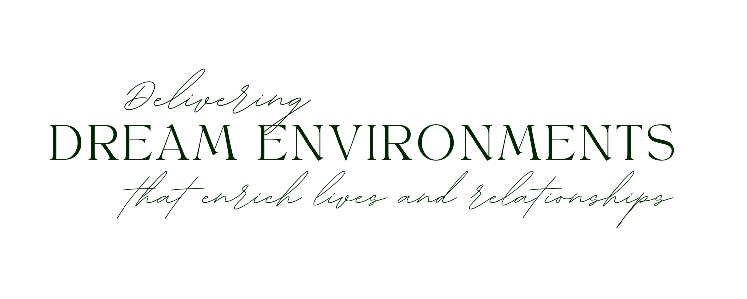 Text graphic with dark background that says 'Delivering DREAM ENVIRONMENTS that enrich lives and relationships' in green and cursive font.