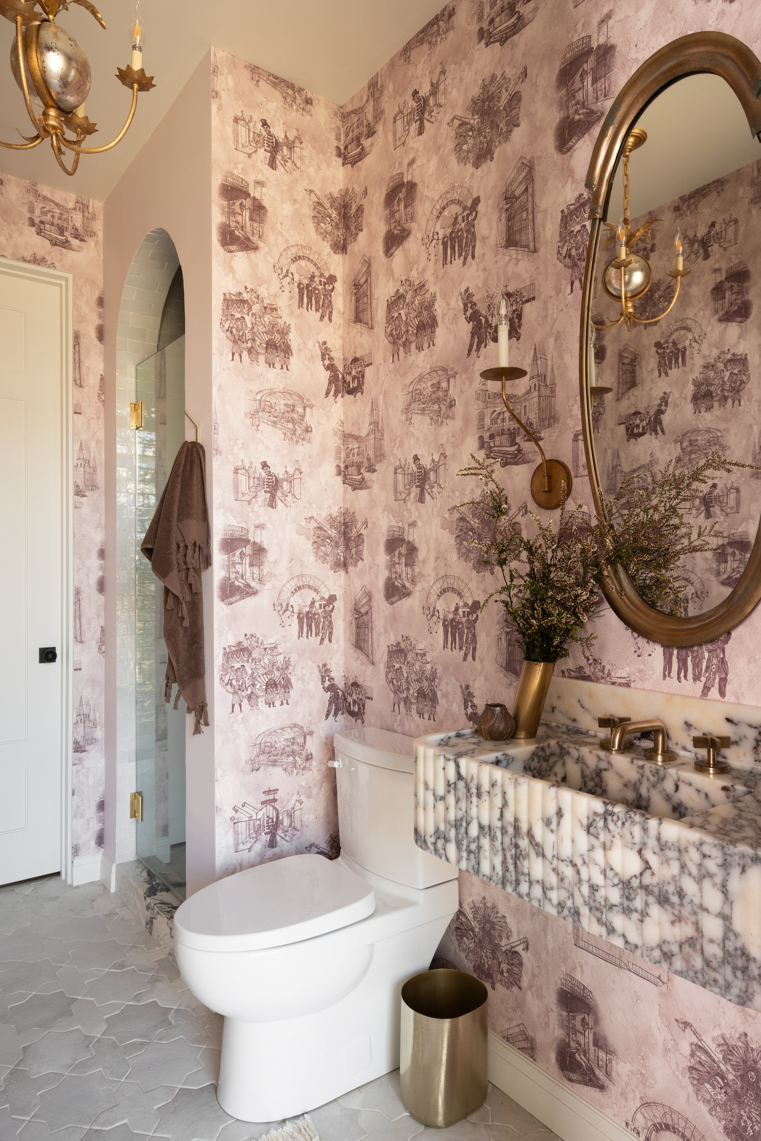 Bathroom with a shallow-depth marble vanity and New Orleans toile wallpaper in an Allito Spaces remodel