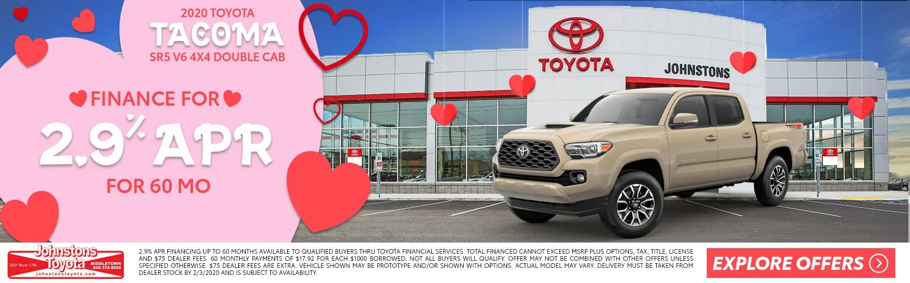 A beige Toyota Tacoma truck parked outside a Toyota dealership. The dealership building has a large Toyota logo and signage with a clear sky overhead. The image includes promotional text for financing with hearts and a pink background.