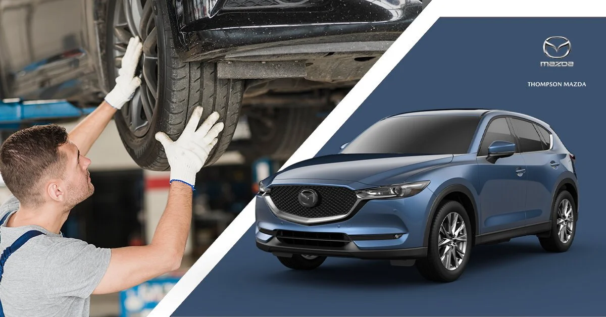 Part of a car being repaired at an auto shop, alongside an image of a blue Mazda SUV with the Mazda logo, dealership name, and model shown.