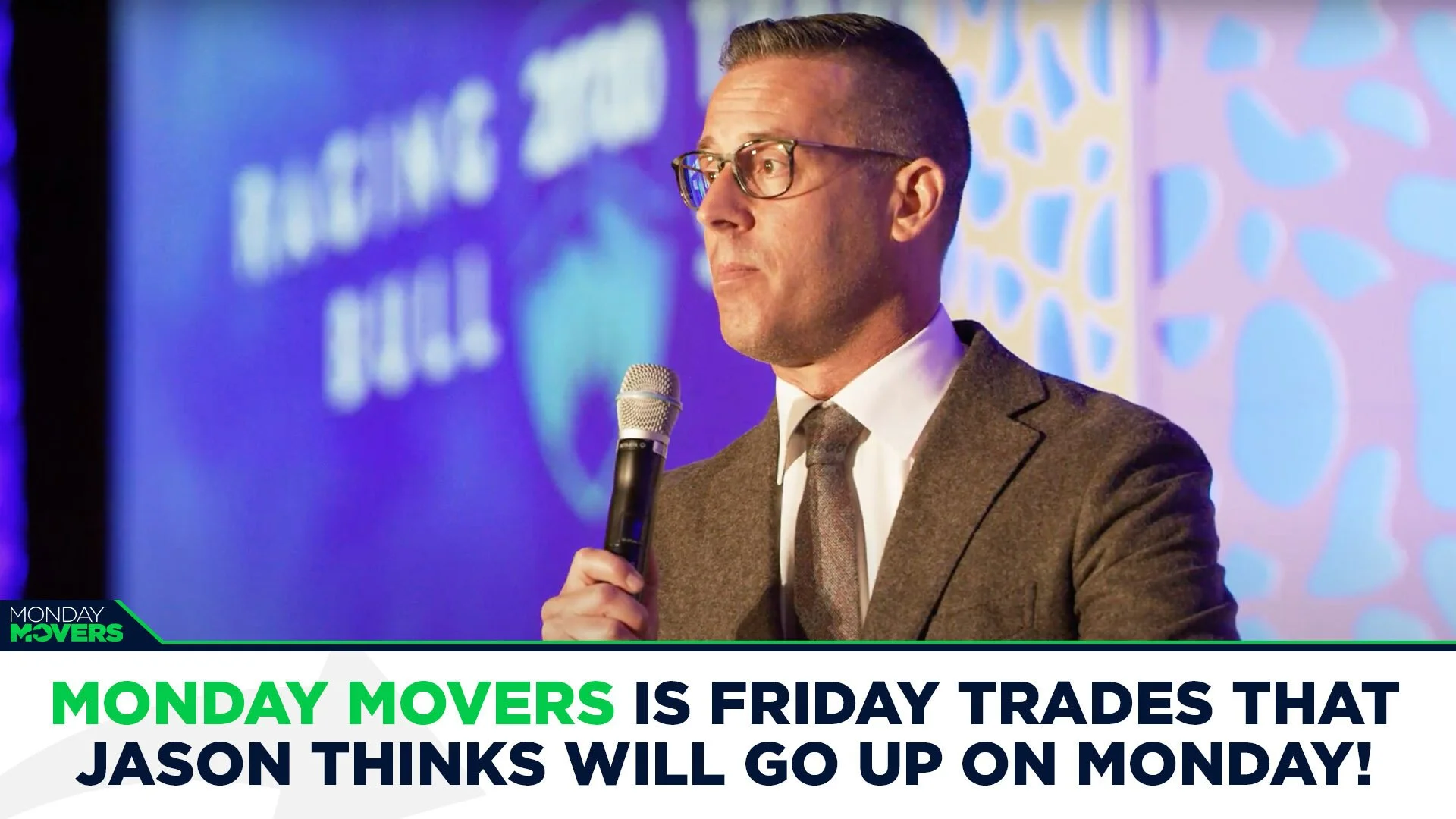 A man in glasses and a suit holding a microphone on stage, with a colorful graphic background and text overlay that reads, "Monday Movers is Friday trades that Jason thinks will go up on Monday!"