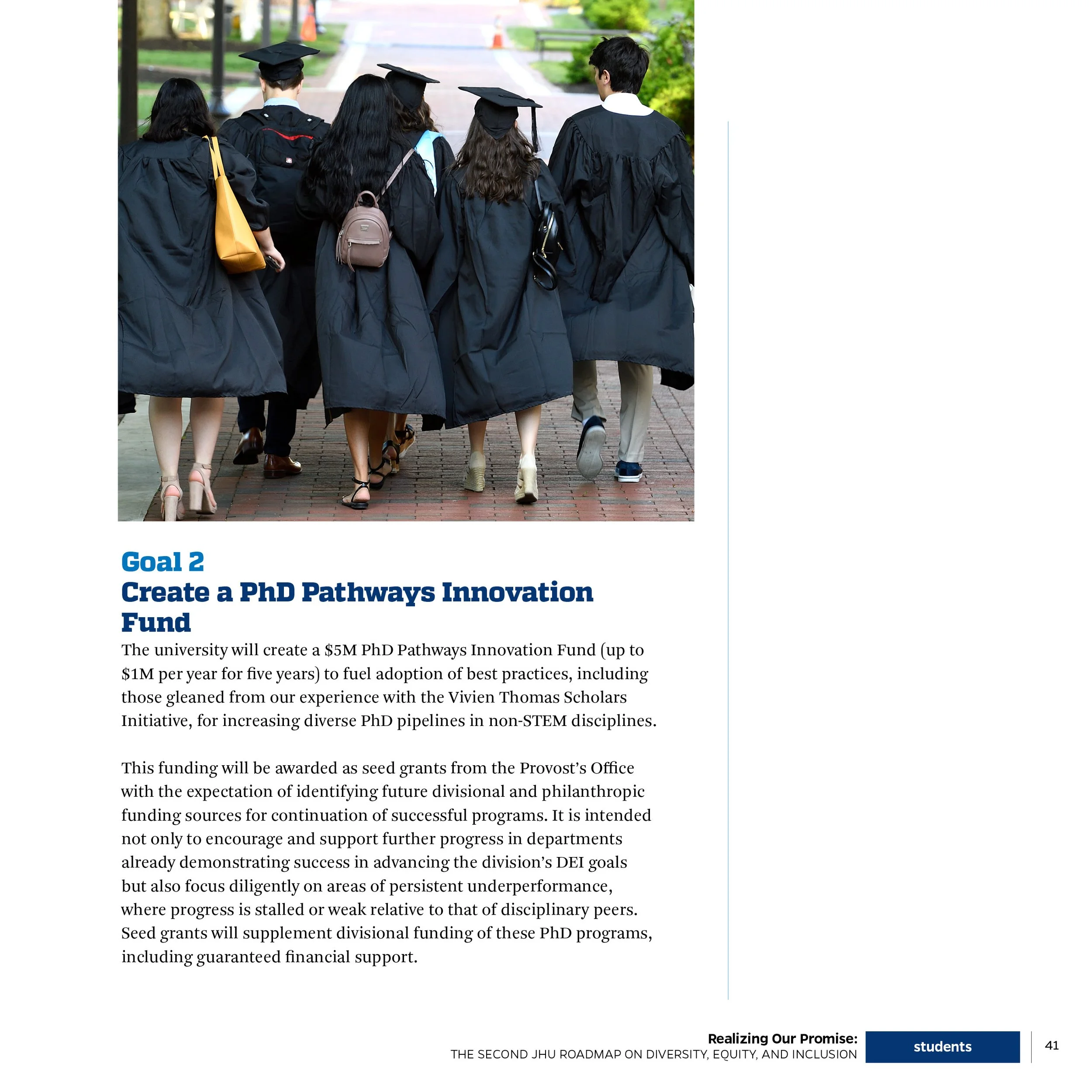 Group of students in caps and gowns walking outside on a brick pathway.