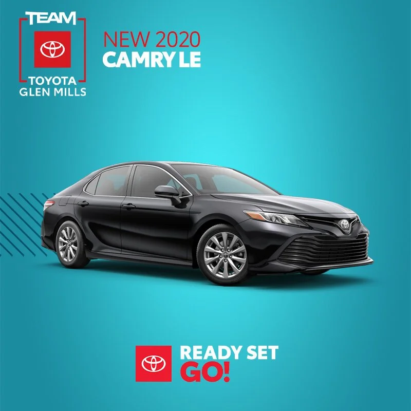 Black 2020 Toyota Camry LE sedan displayed on a blue background with promotional text for Toyota Glen Mills.