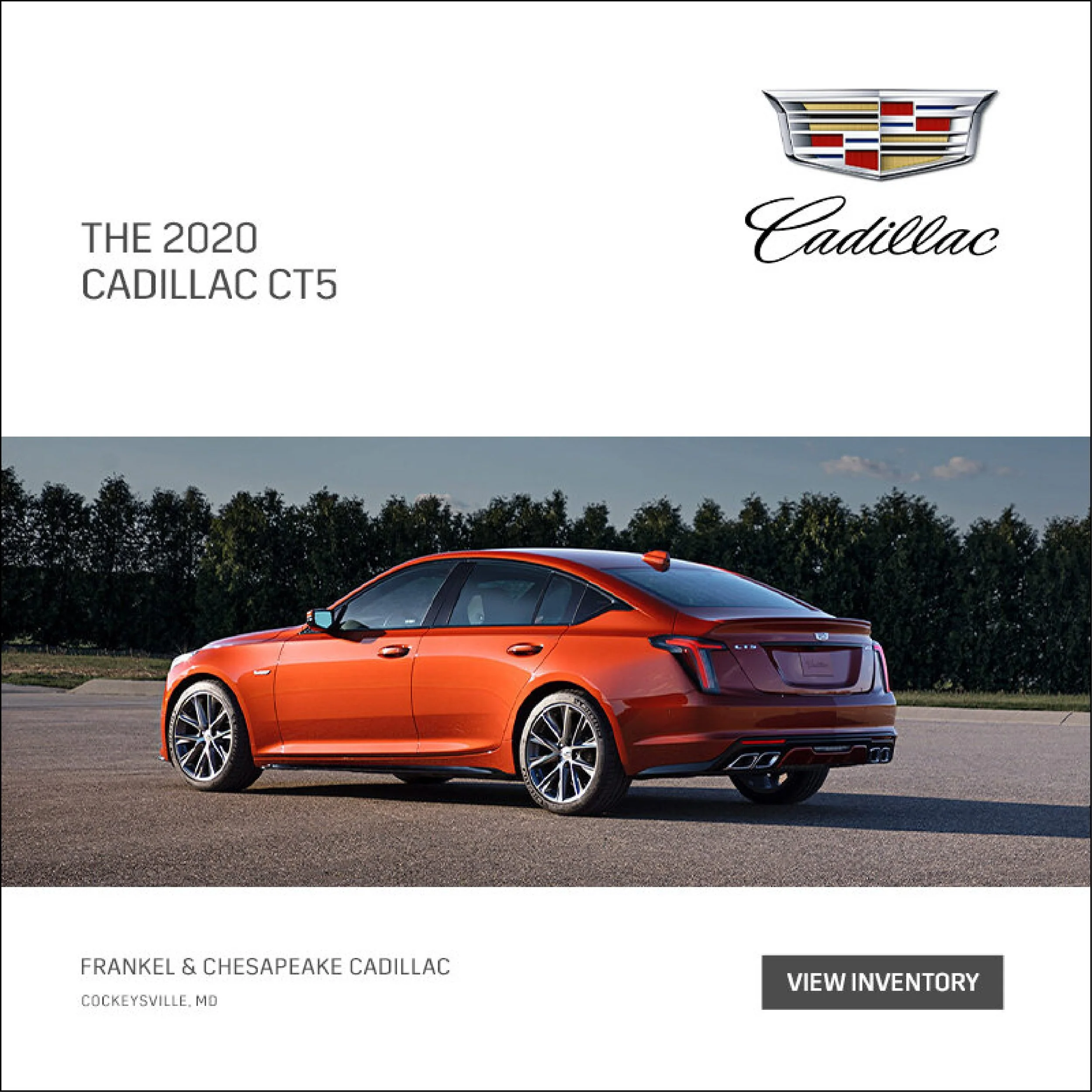 2020 Cadillac CT5 sedan in orange color parked on the road with trees in the background.