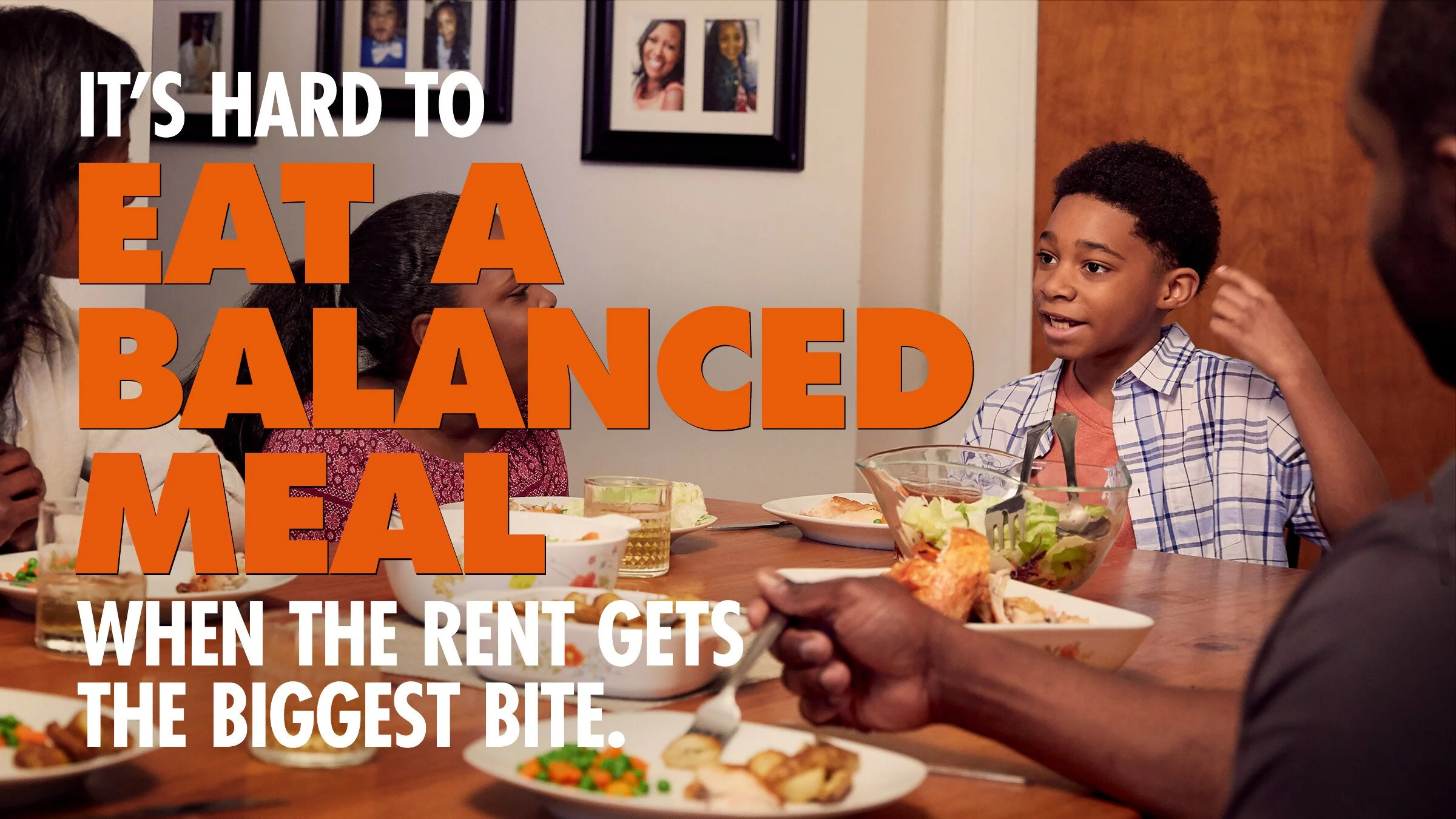 A family gathered around a dinner table having a meal. Text overlaid on the image reads, 'It's hard to eat a balanced meal when the rent gets the biggest bite.'