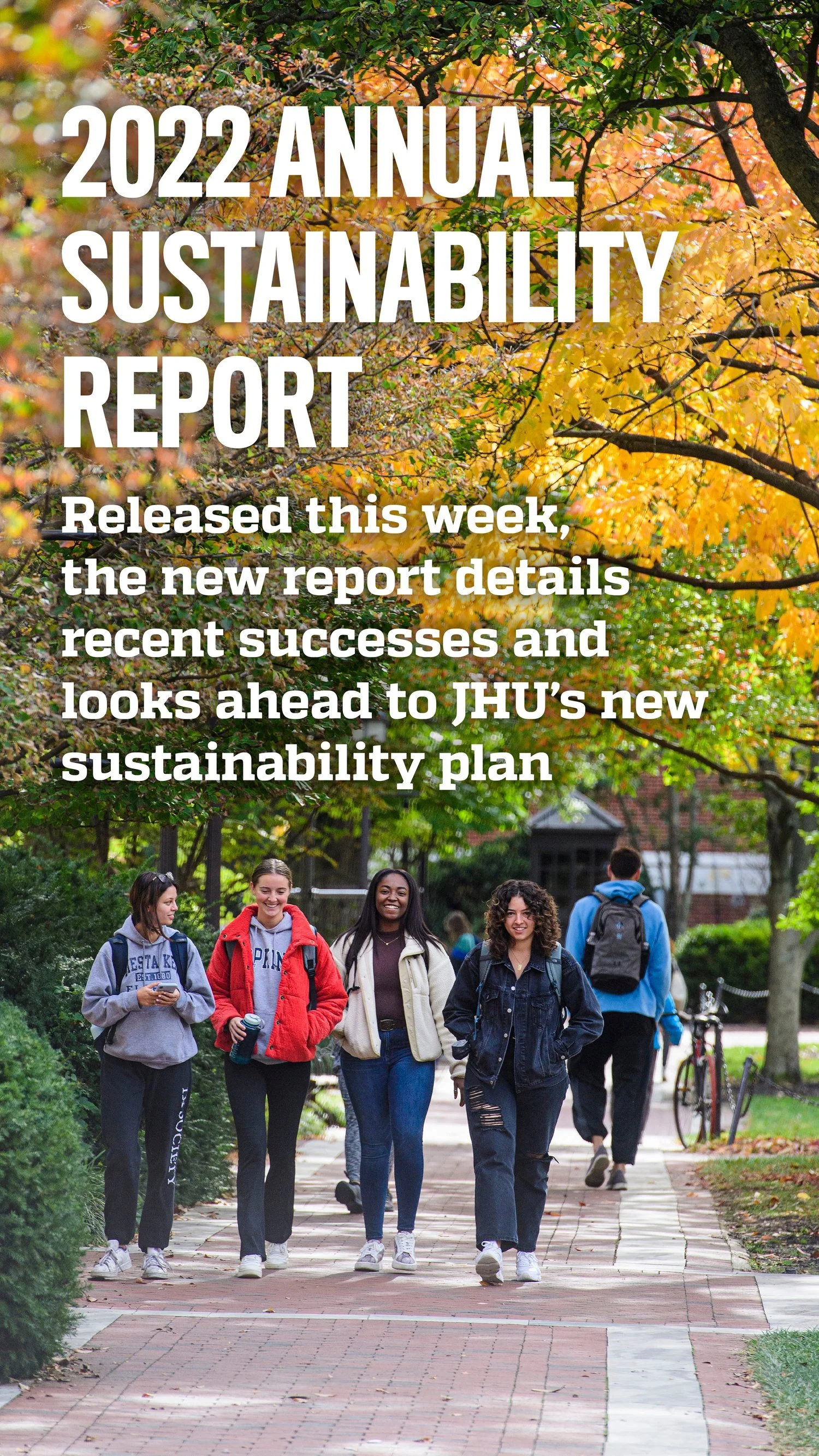 Four smiling students walking on a brick pathway in a park-like setting with trees and autumn leaves, as part of the 2022 Annual Sustainability Report announcement.