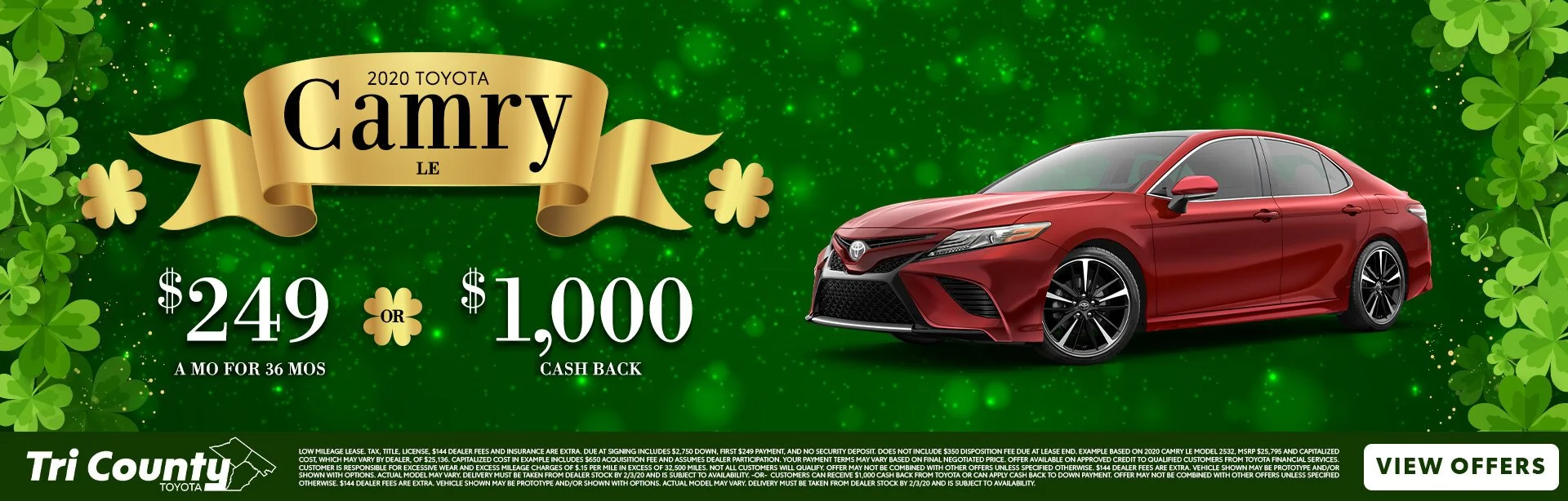 A promotional advertisement for a 2020 Toyota Camry, featuring a red car on a green background with shamrocks and a gold ribbon banner. The ad highlights a special offer: $249 monthly payments for 36 months or a $1,000 cashback, with the dealership l