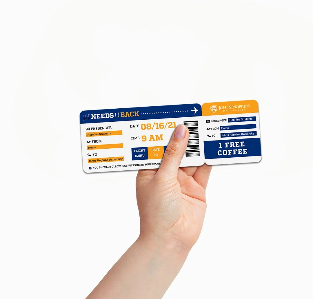 A person's hand holding a flight ticket for Johns Hopkins University with details including date, time, and flight information, and an offer for one free coffee.