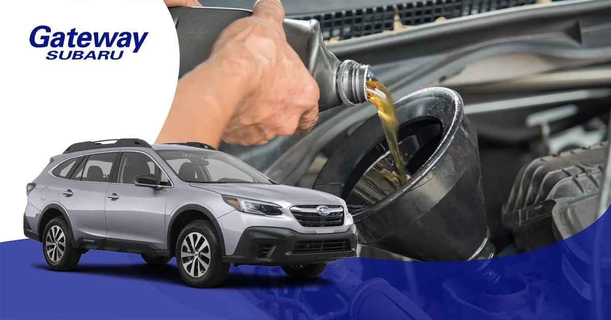 A person pouring motor oil into a car's engine, with a gray Subaru SUV and Gateway Subaru logo visible in the foreground.