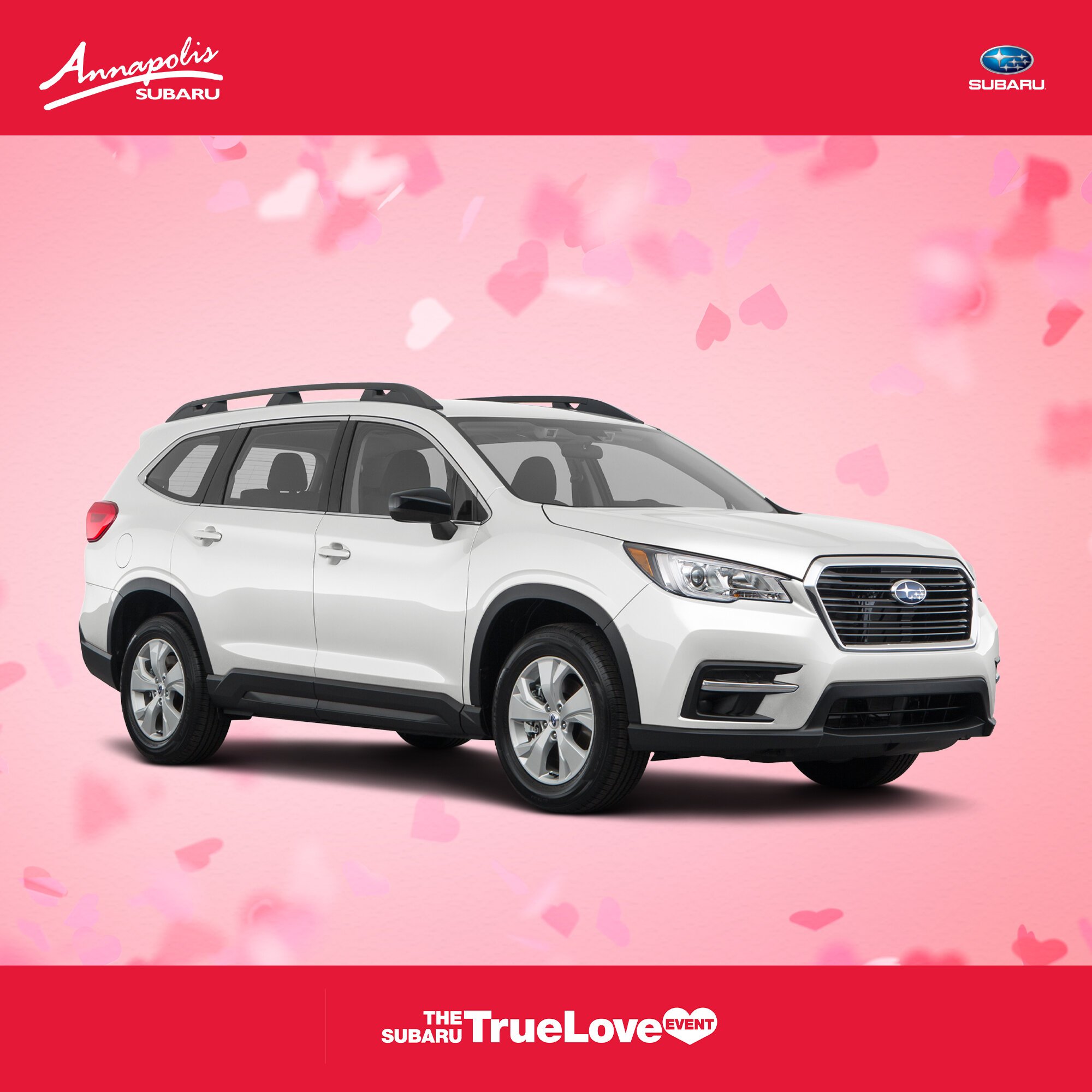 A white Subaru SUV with a pink background and floating heart shapes, featuring the Subaru logo and text promoting The Subaru True Love Event.