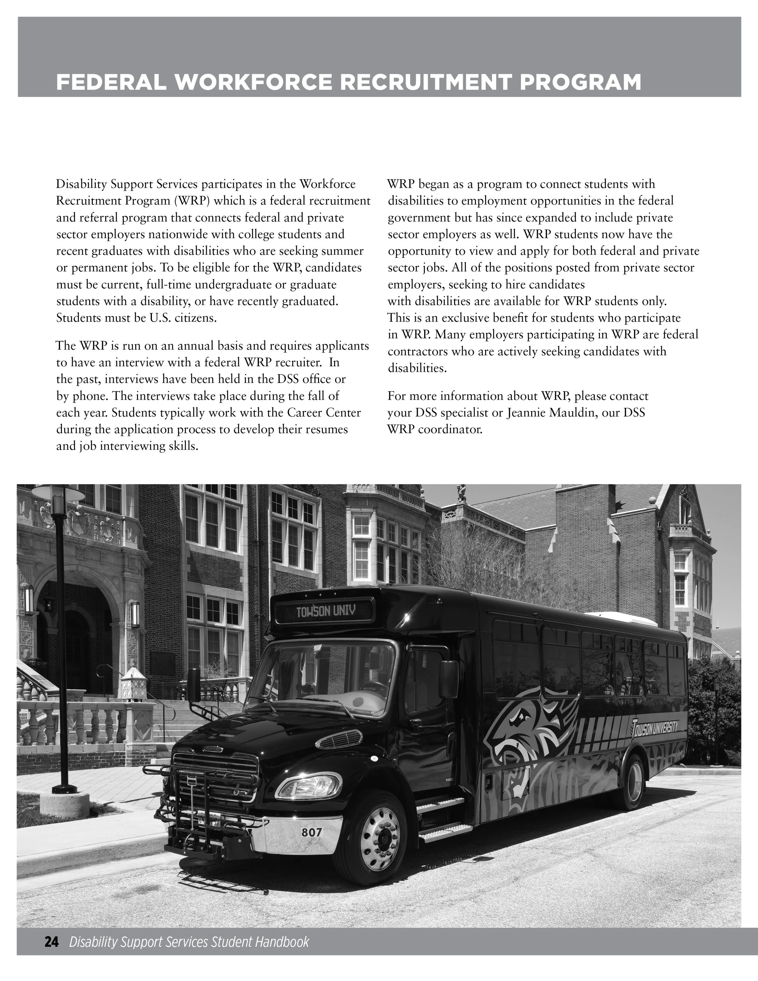 Black shuttle bus with Towson University logo and a gryphon mascot graphic parked in front of a brick building with stairs and a lamppost.