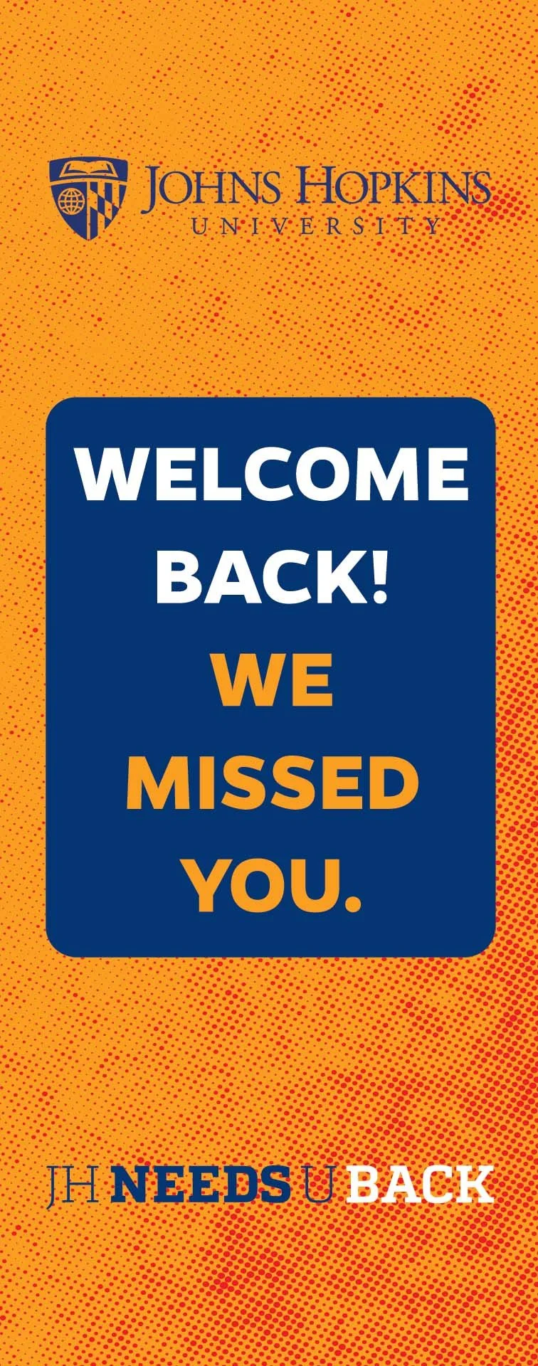 A Johns Hopkins University poster with a blue and orange background, displaying a message "Welcome Back! We Missed You" and the phrase "JH Needs U Back" at the bottom.