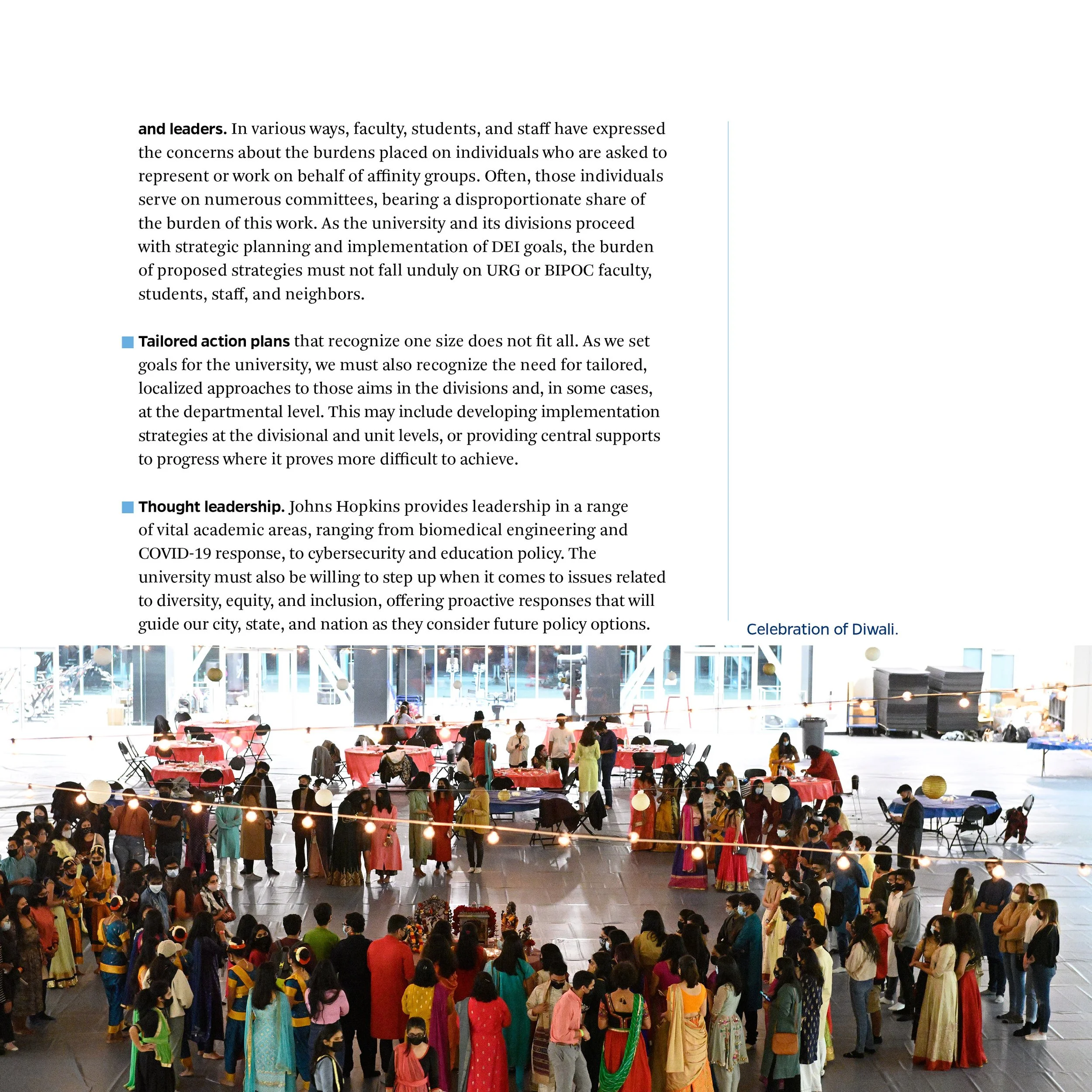 Photograph of a Diwali celebration with people wearing traditional Indian attire, gathered in an indoor space decorated with string lights and lanterns.