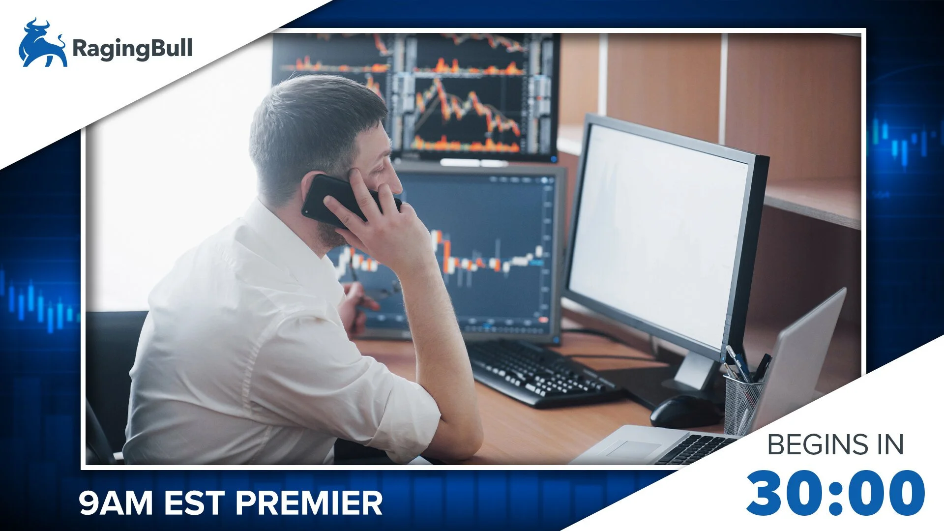A man with short hair and a white shirt is sitting at a desk in front of three computer monitors displaying stock charts. He is talking on a black phone held to his ear, with his right hand resting on a keyboard. The office has bright natural light, 