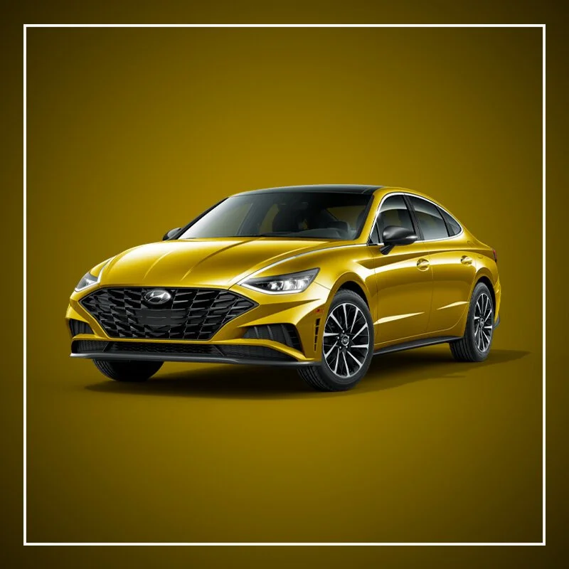 A yellow modern sedan car with black accents against a yellow background.