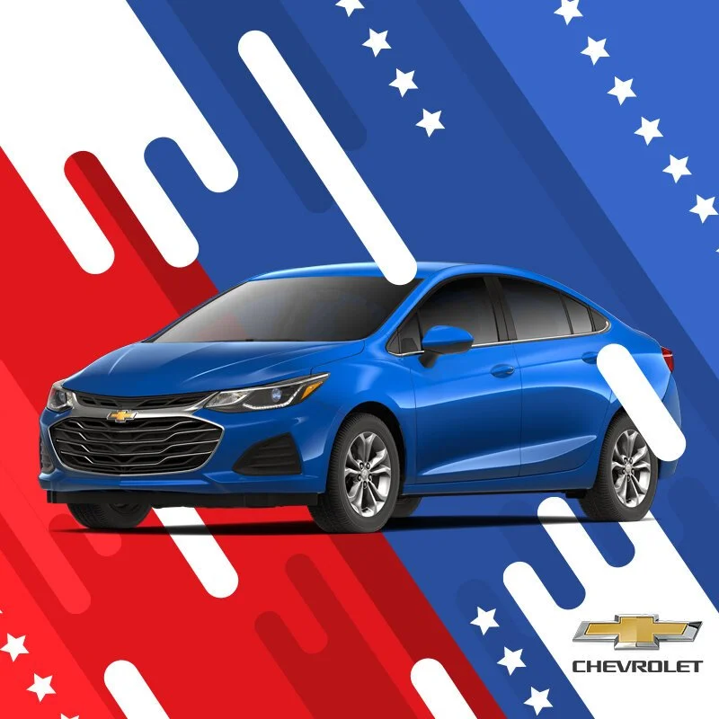 A blue Chevrolet sedan on a patriotic background with red, white, and blue stripes, stars, and the Chevrolet logo.
