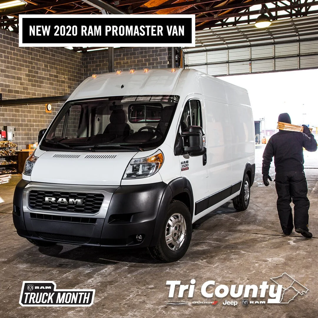 A white 2020 RAM ProMaster van parked inside a warehouse, with a person walking away carrying a load on their shoulder.