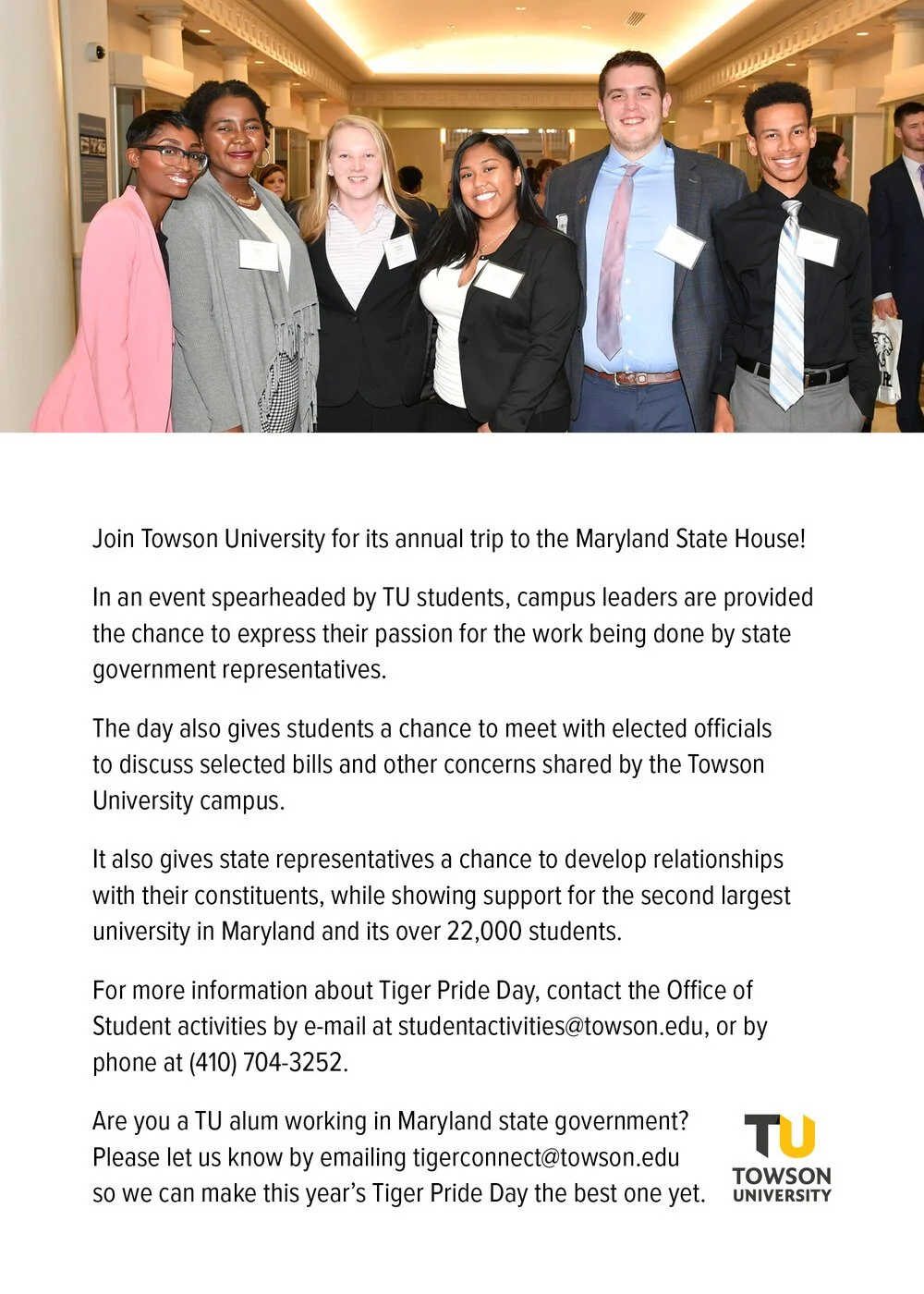 A diverse group of six young adults dressed in business casual attire, smiling together in an indoor setting.