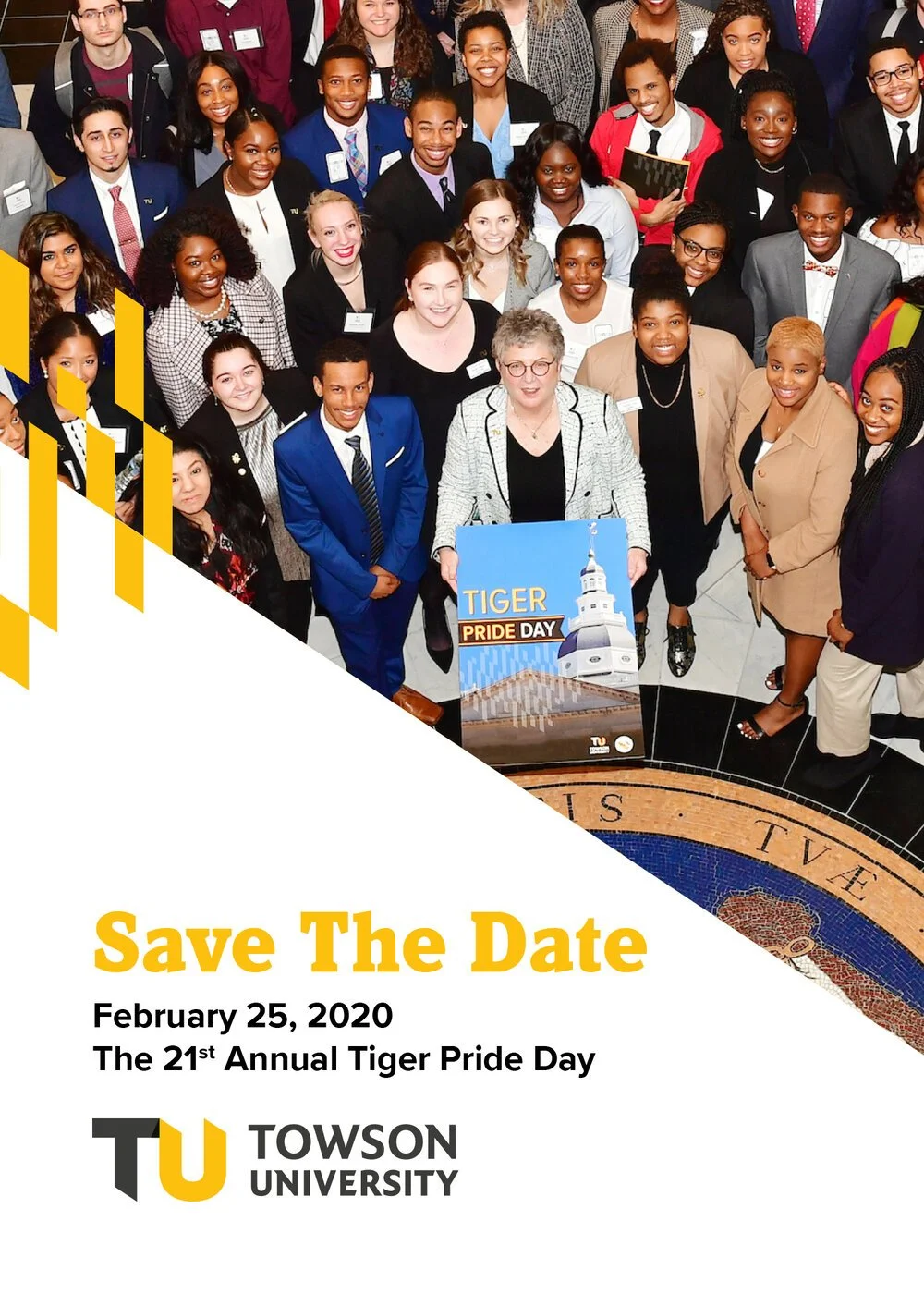 A group of diverse students and faculty members gathered for Towson University's Tiger Pride Day event, holding a sign that says 'Tiger Pride Day,' with a large group photo taken from above.