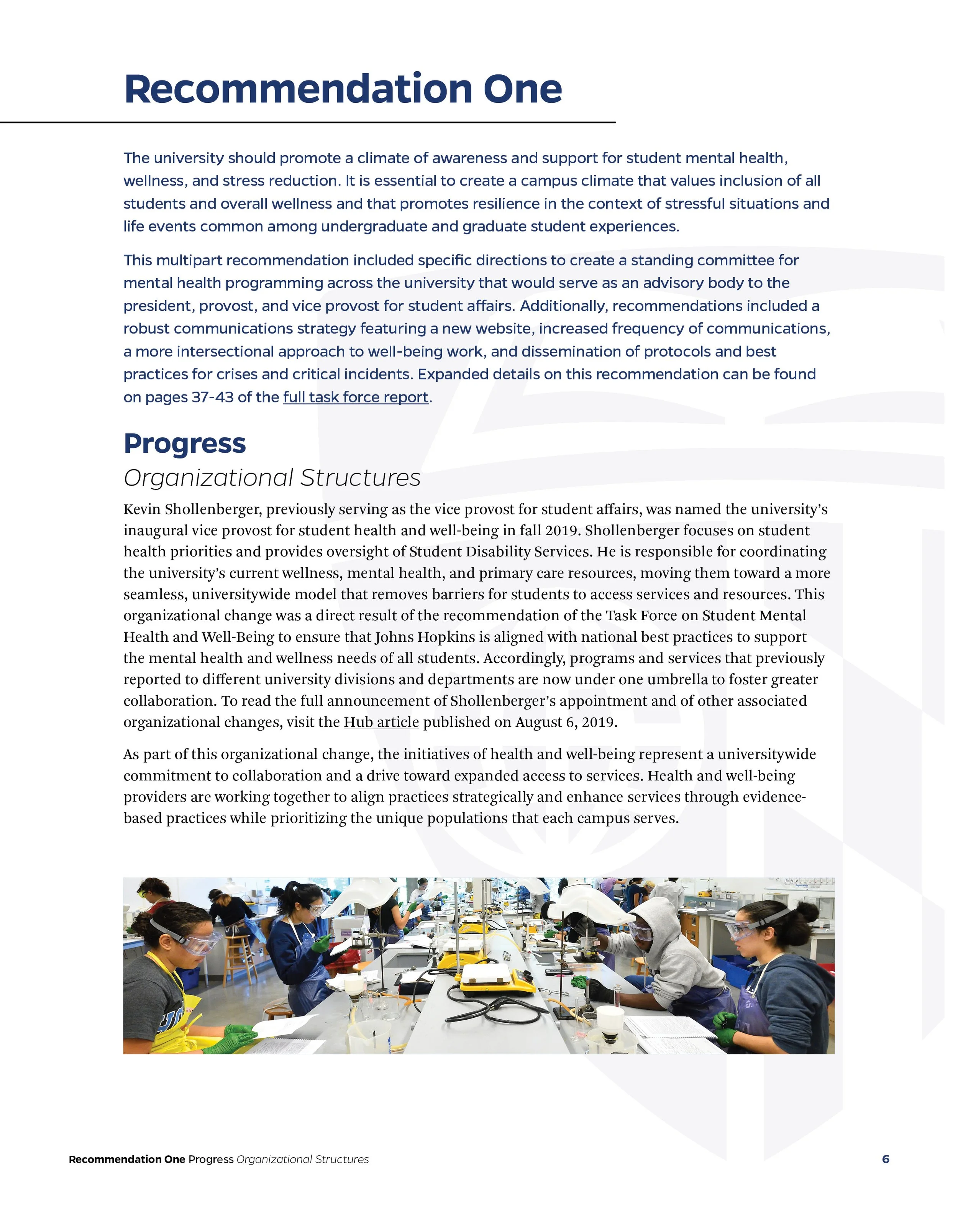 A printed page from a report discussing university mental health strategies, featuring a section titled 'Progress' with text about organizational change and a photo of students working in a science laboratory.