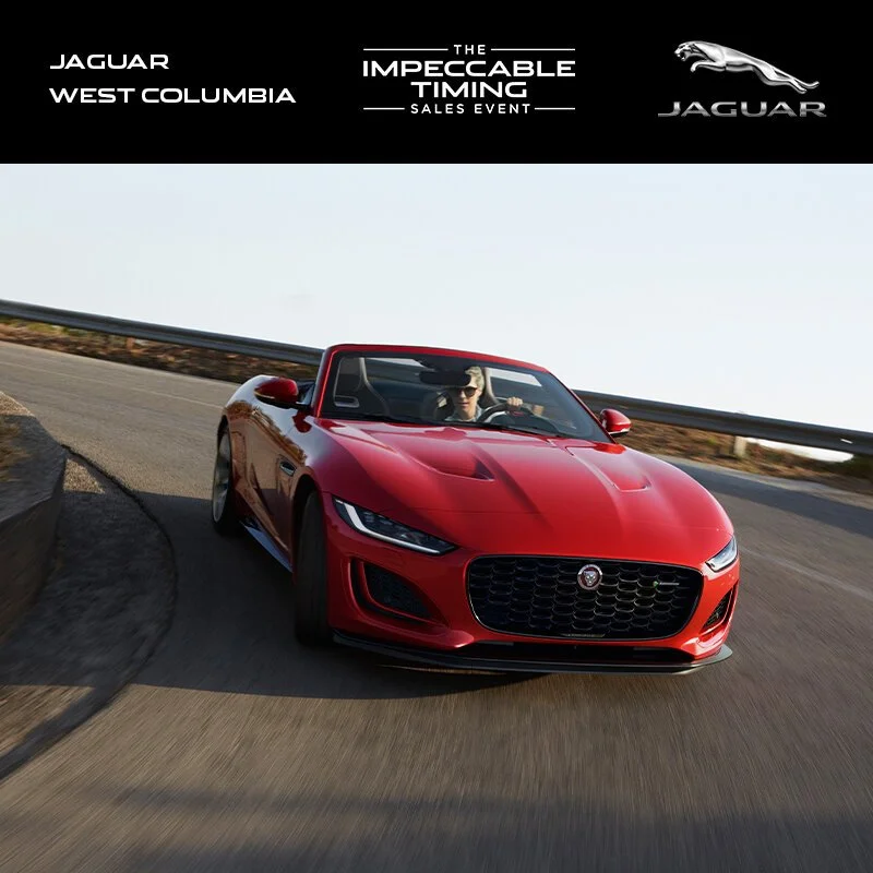 A woman driving a red Jaguar convertible on a mountain road during the day, with a black banner at the top displaying Jaguar's logo and promotional text for a sales event.