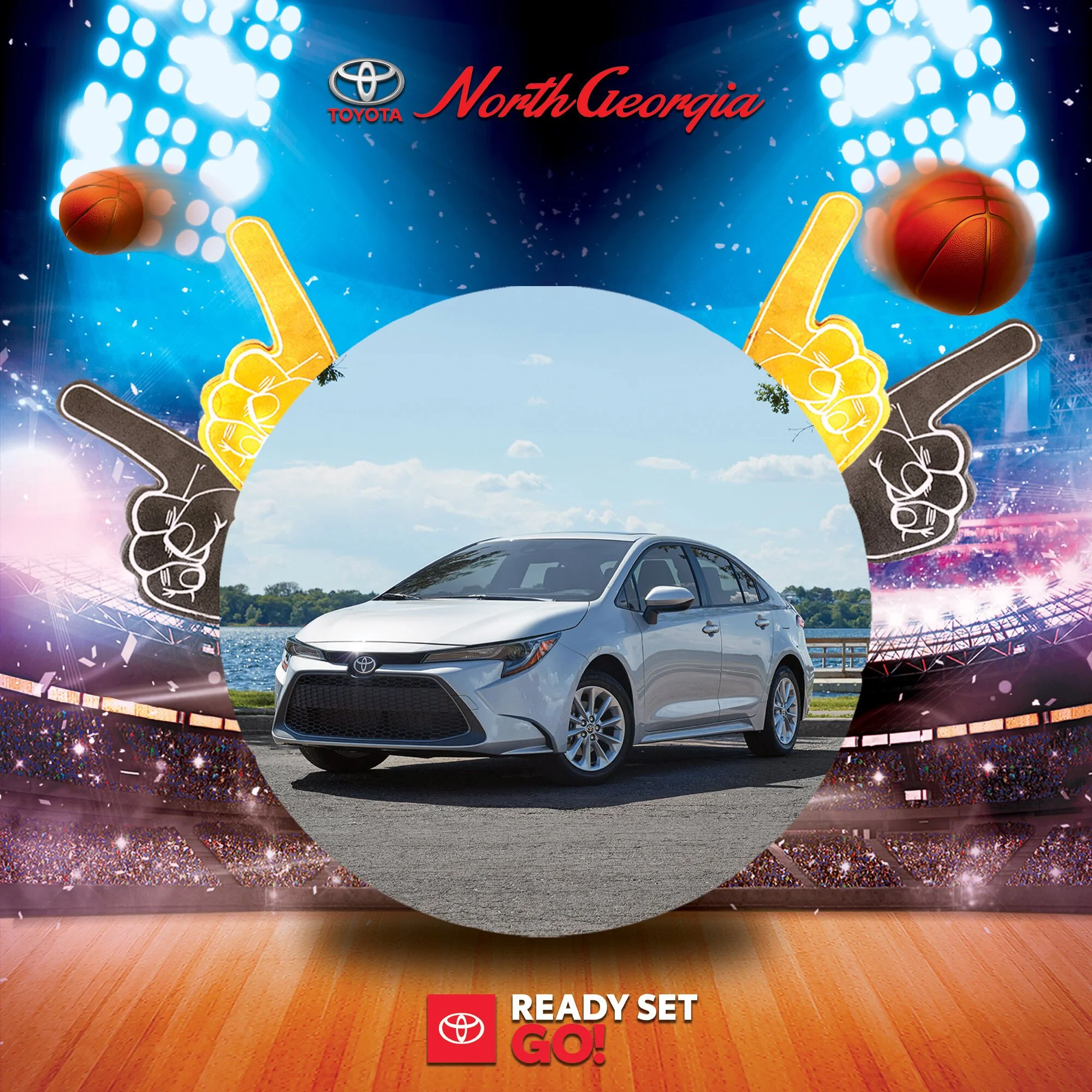 A silver Toyota sedan parked outdoors near a water body with a town in the background, overlaid on a sports arena background with basketballs and animated hand-drawn basketball players, featuring branding for North Georgia Toyota and the slogan "Read