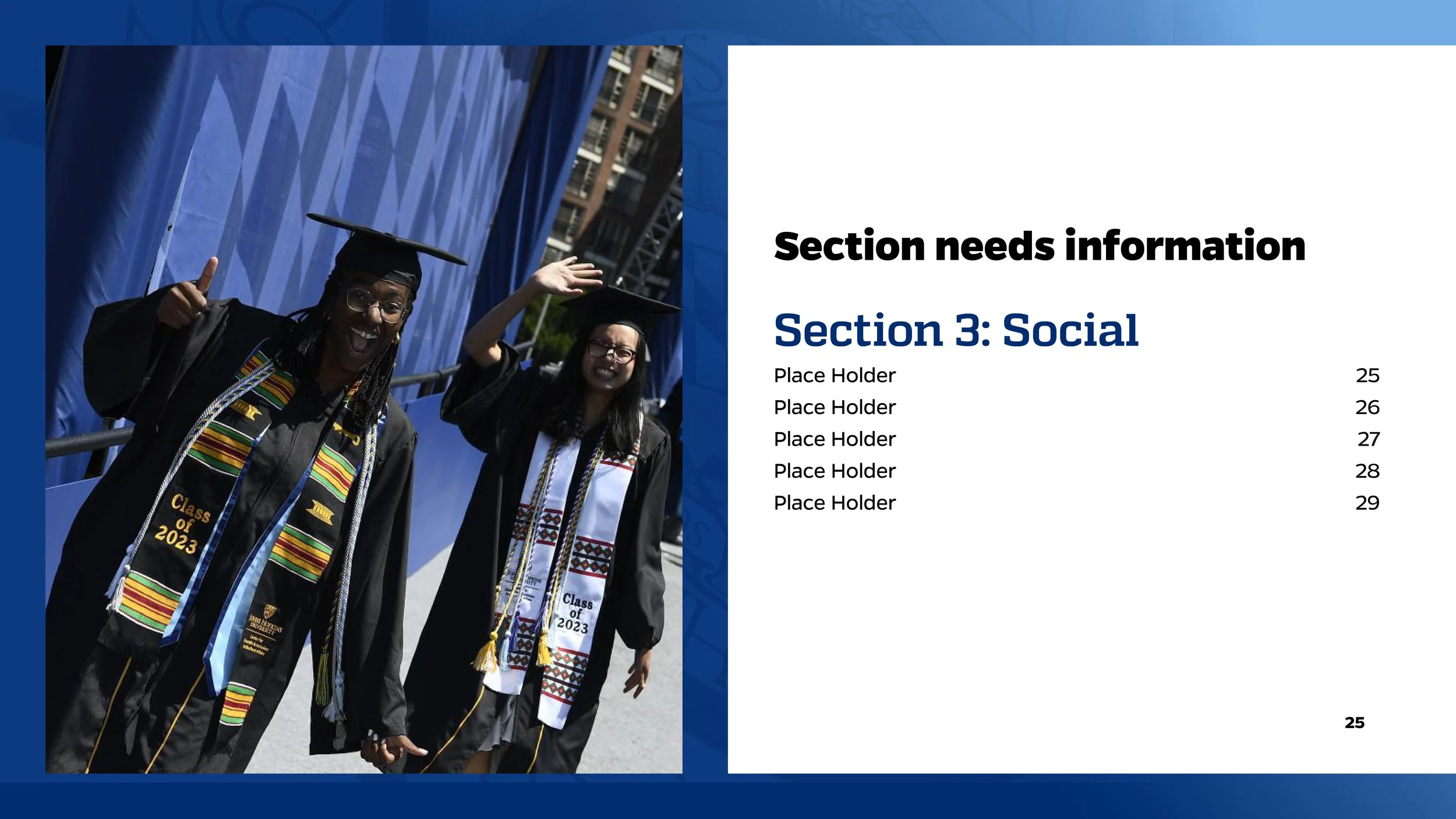 A group of graduates in black caps and gowns smiling and waving at a graduation ceremony, with one giving a thumbs up and another waving. They are outdoors near a blue structure and buildings.