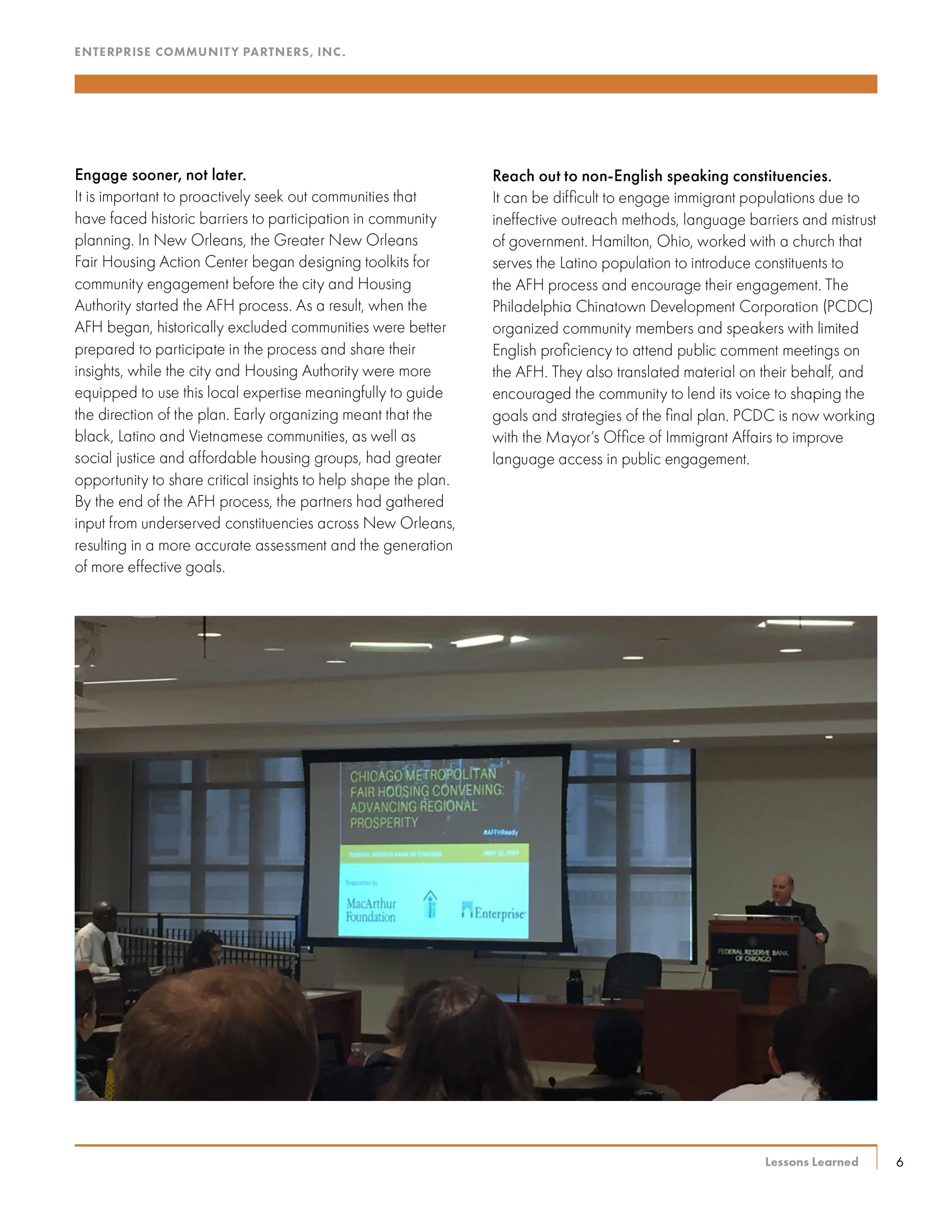 A conference room with a speaker standing at a podium labeled 'Federal Reserve Bank of Chicago,' and a large screen displaying a title about a Chicago Metropolitan Fair Housing Convening. Attendees are seated, facing the speaker and the screen.