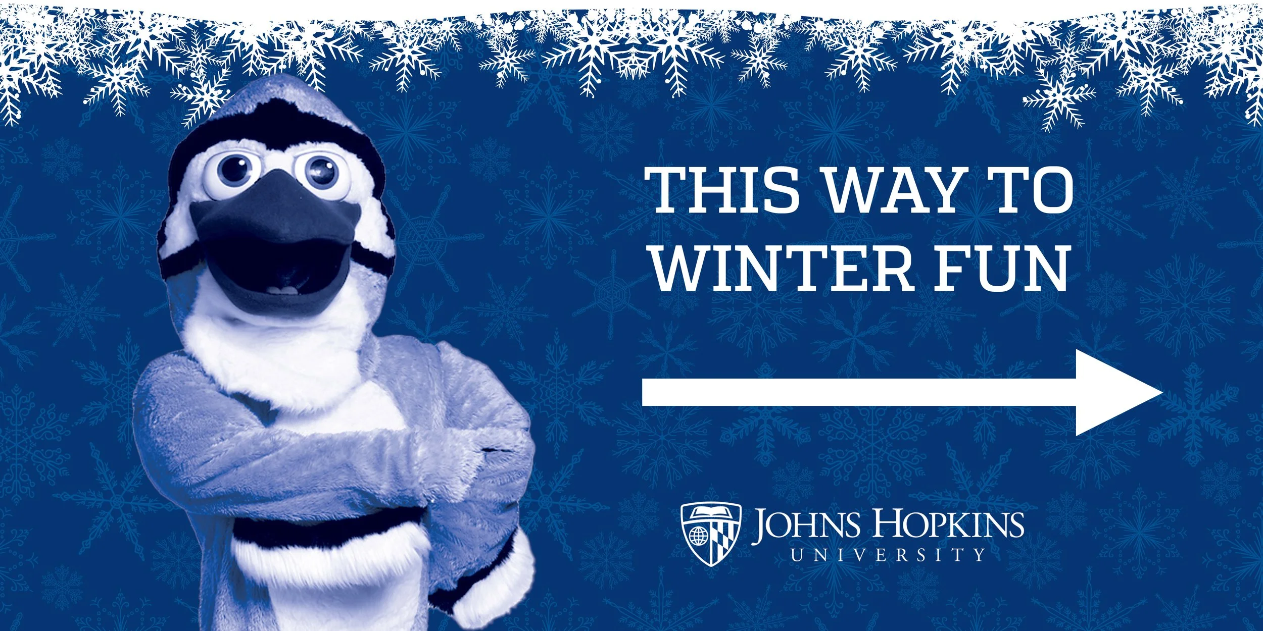 A mascot with a bird's face wearing a beanie hat and a furry costume, standing with crossed arms against a blue background with snowflake patterns, pointing to the right alongside text that reads 'This way to winter fun' and the Johns Hopkins Univers