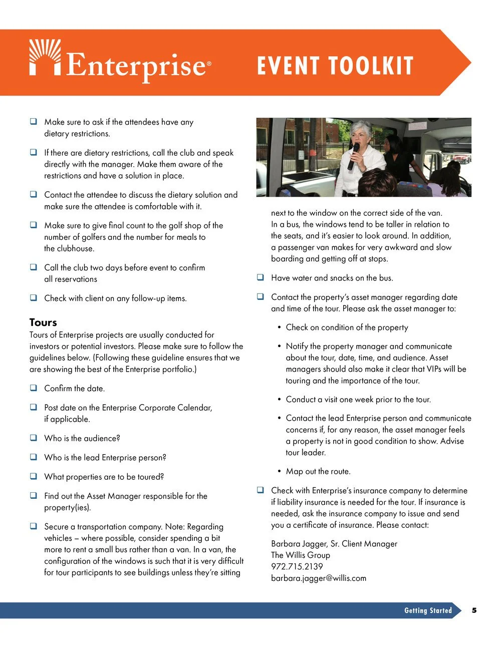 A woman speaking into a microphone on a bus, surrounded by passengers, with others seated behind her.