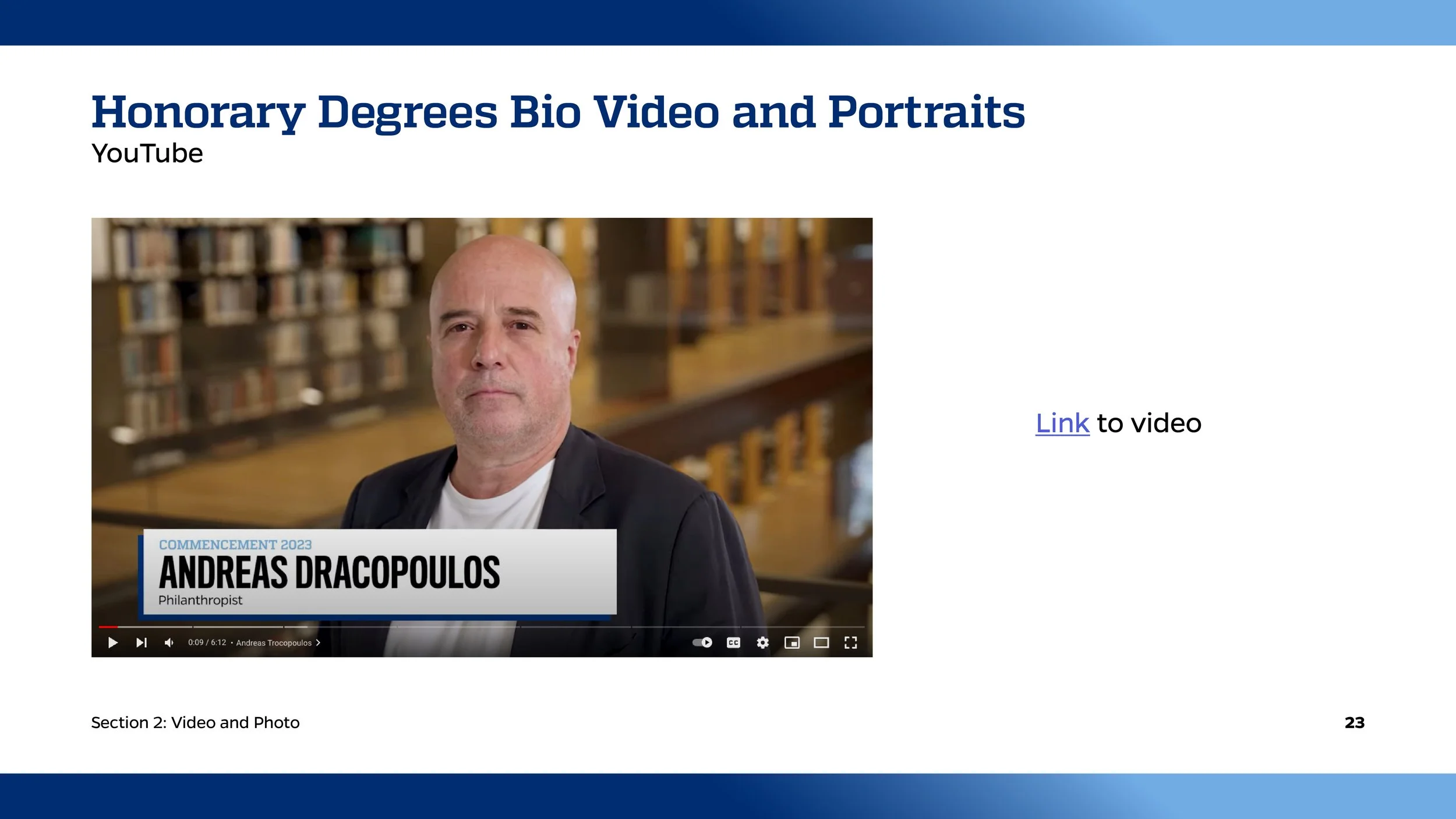Screenshot of a presentation slide titled 'Honorary Degrees Bio Video and Portraits.' It features a paused YouTube video of Andreas Dracopoulos, labeled 'Philanthropist,' with a background of a library. The slide includes a note 'Link to video' and t