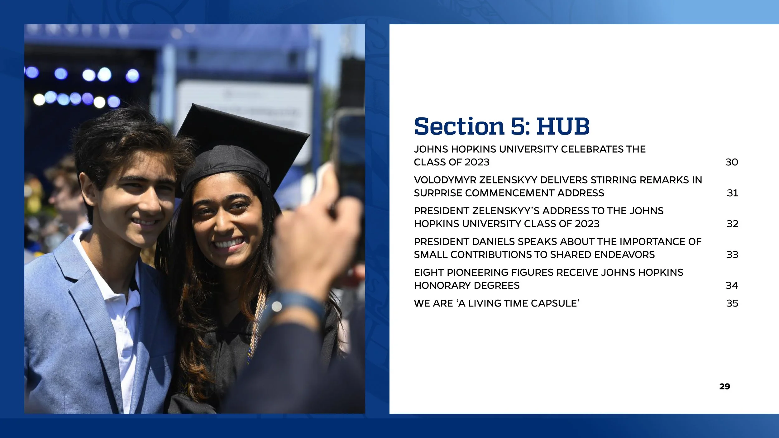 A young man and woman in graduation attire taking a selfie at a graduation ceremony, with the woman wearing a mortarboard. The background suggests an outdoor event.