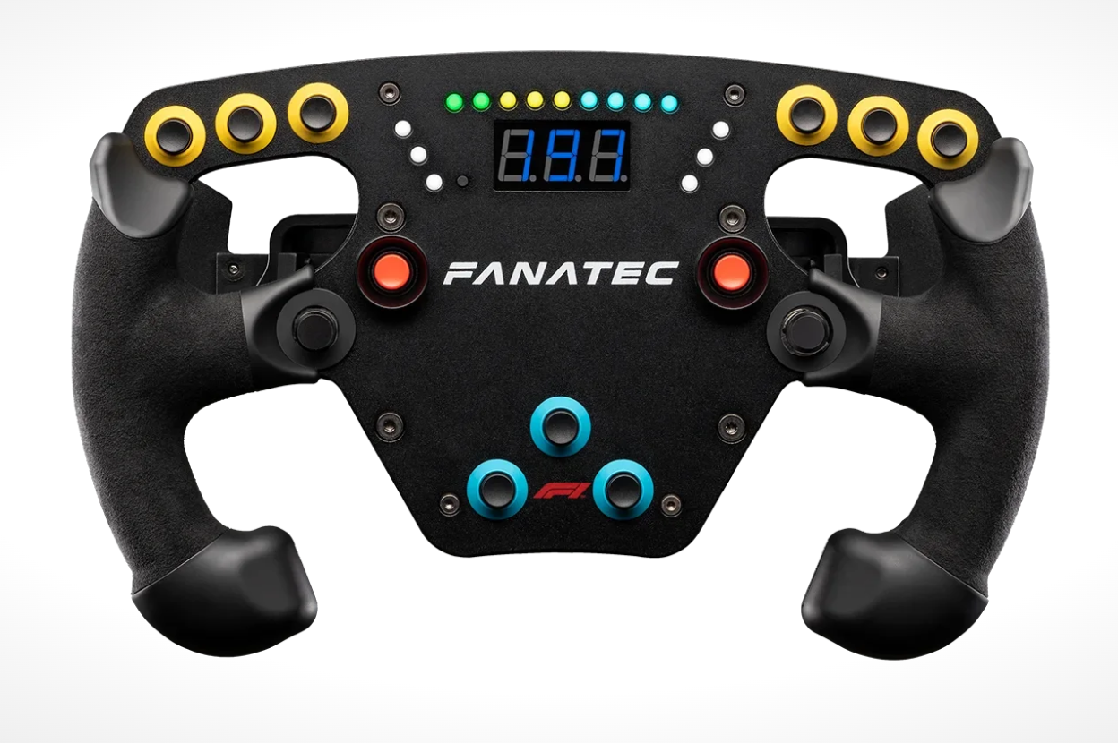 F1 racing game steering wheel controller with digital display and multiple colored buttons.