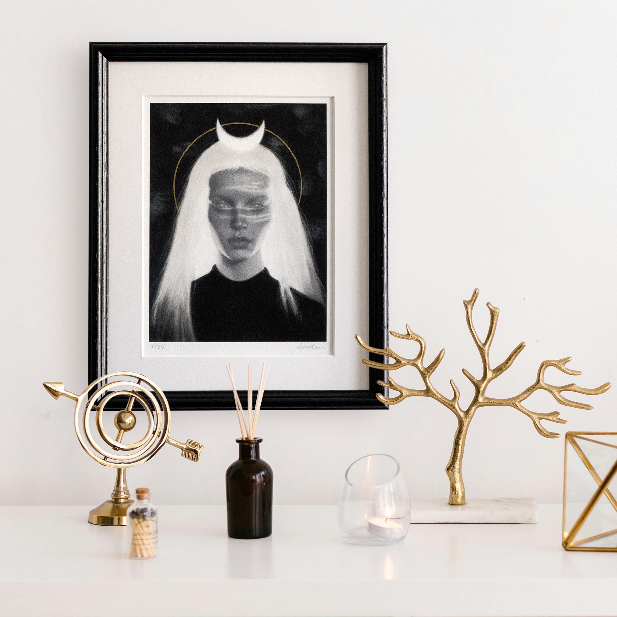 home decor featuring the framed limited edition print Numina by avidoma, hand-painted with a gold ink halo, featuring the portrait of a woman representing the Wild woman archetype