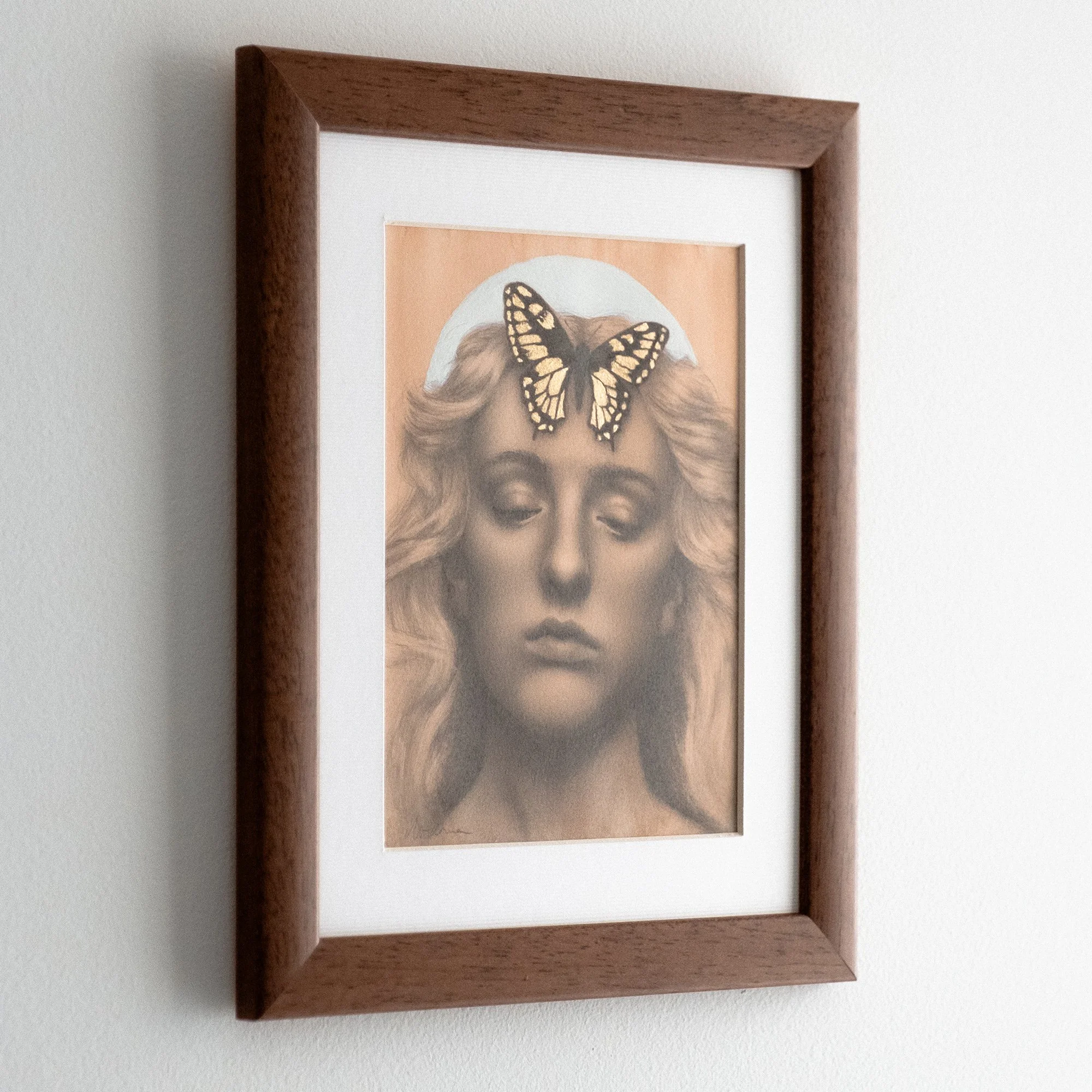 Unique framed original art by avidoma, a graphite portrait drawing with a golden butterfly symbolizing the energy of the Summer Solstice.