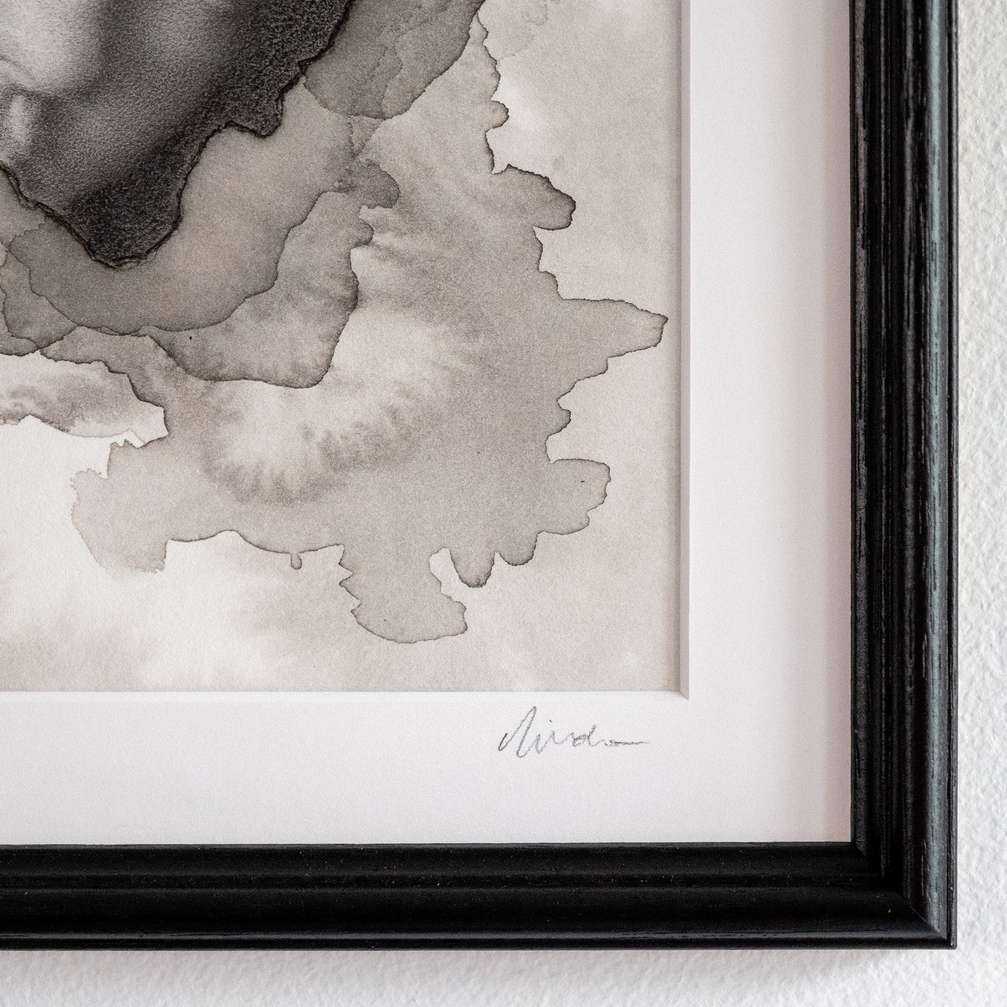 close up of a framed drawing showing beautiful ink textures on paper and the artist signature